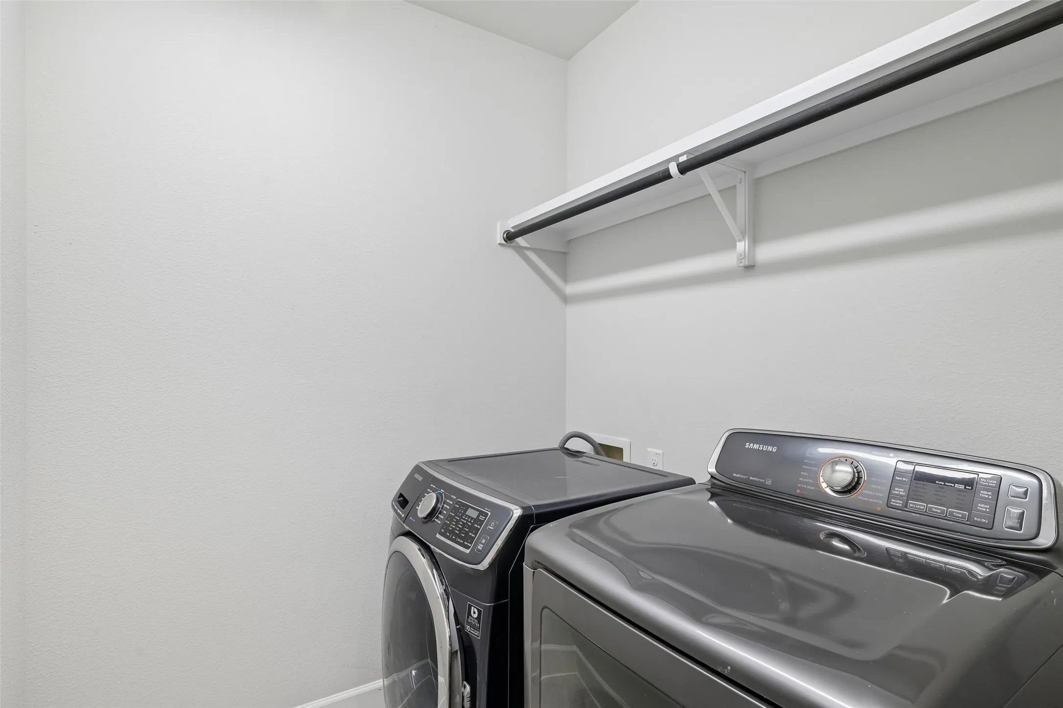 upstairs utility room with storage space