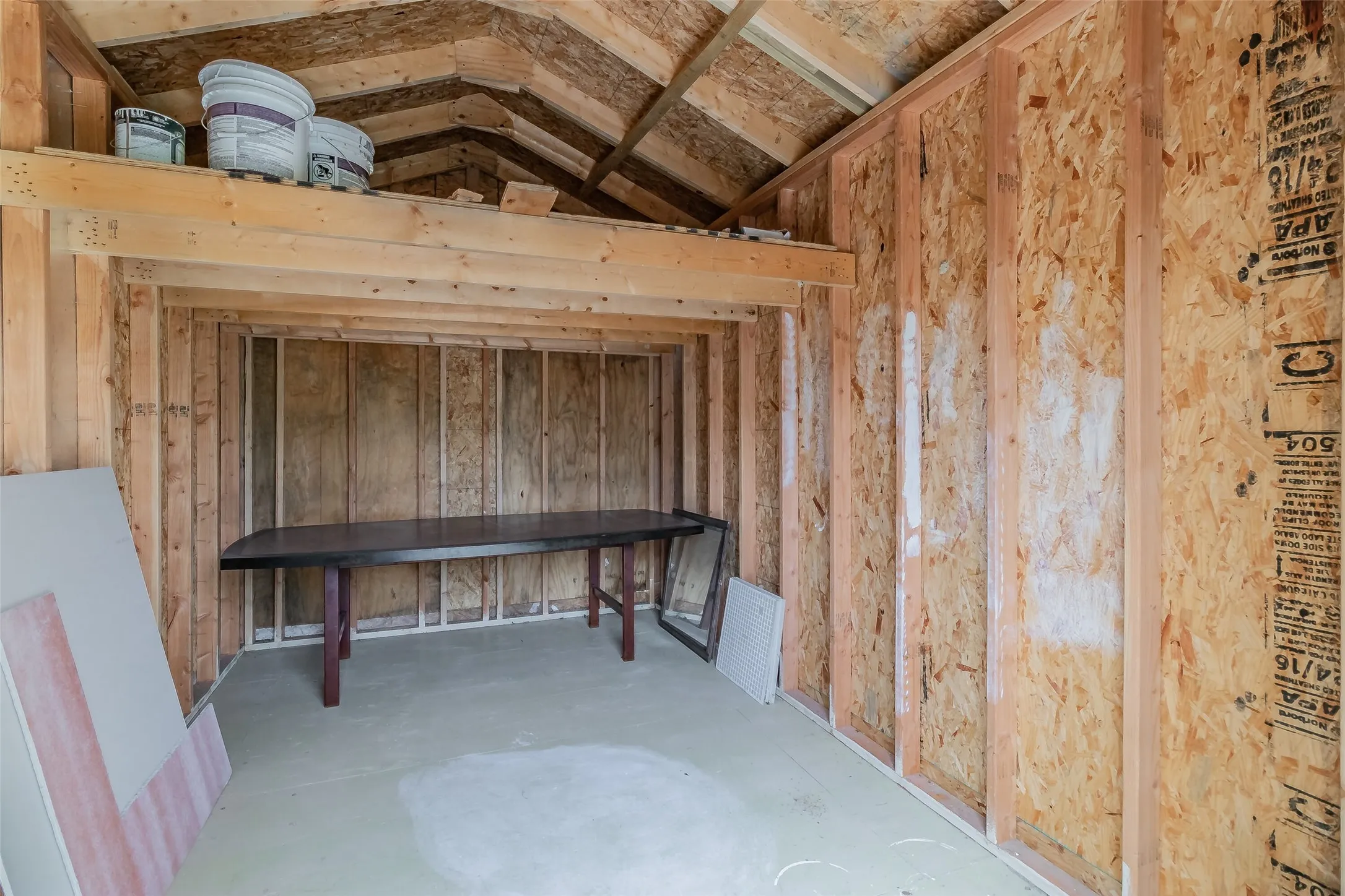 Exposed wood framing with an integrated loft storage area