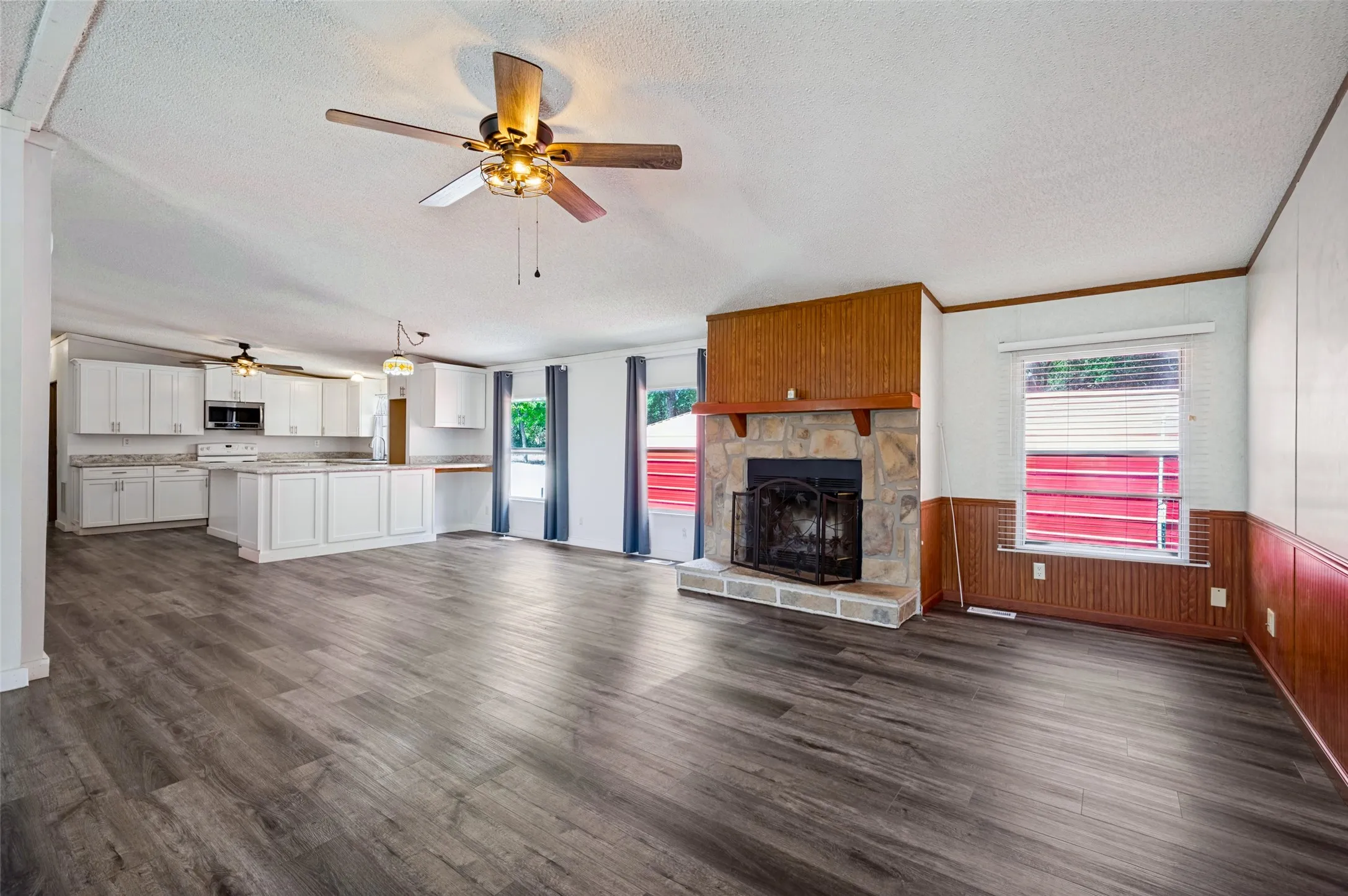 Open concept floor plan with kitchen overlooking breakfast and family room.