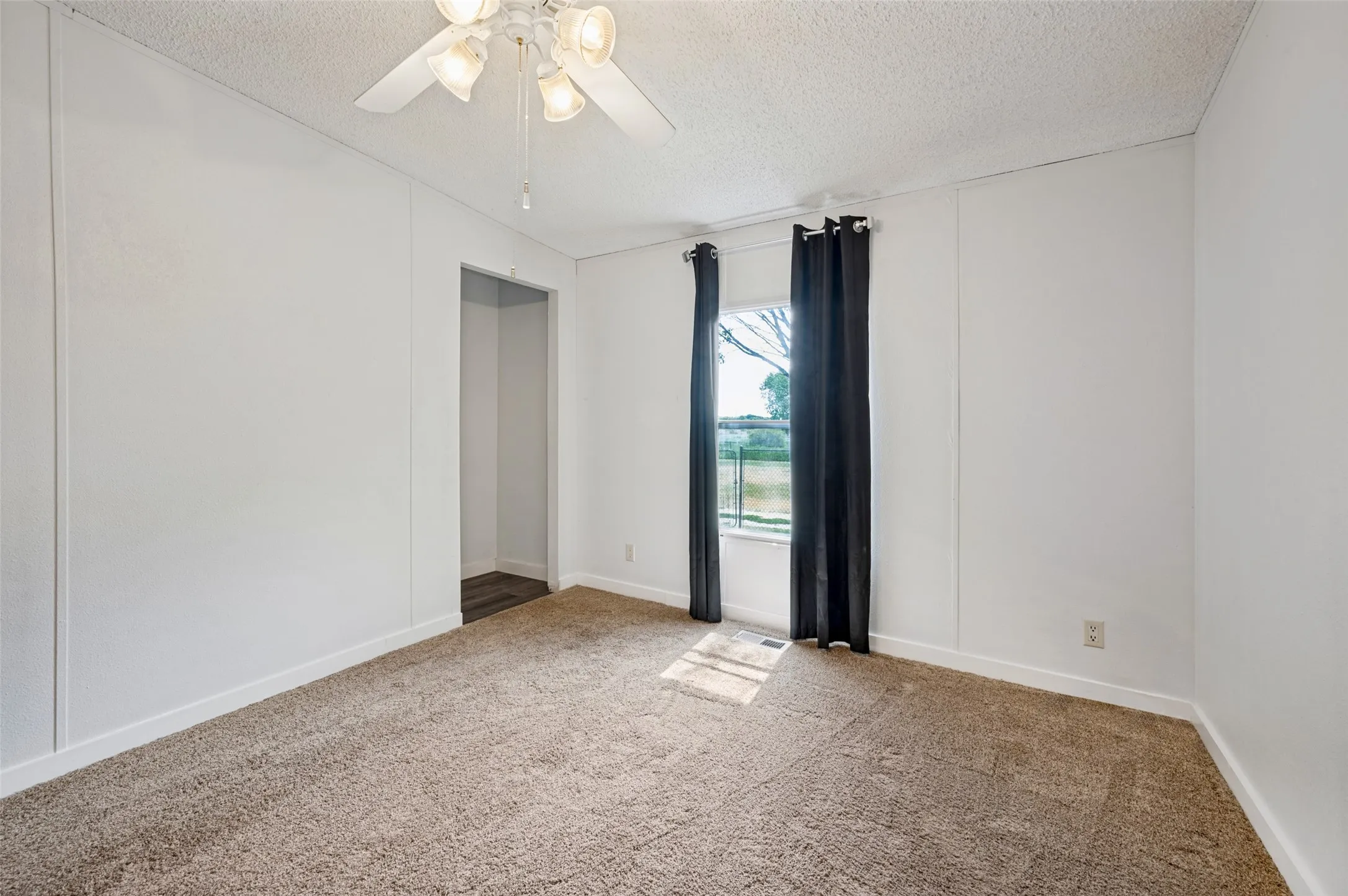 Secondary bedroom with carpet