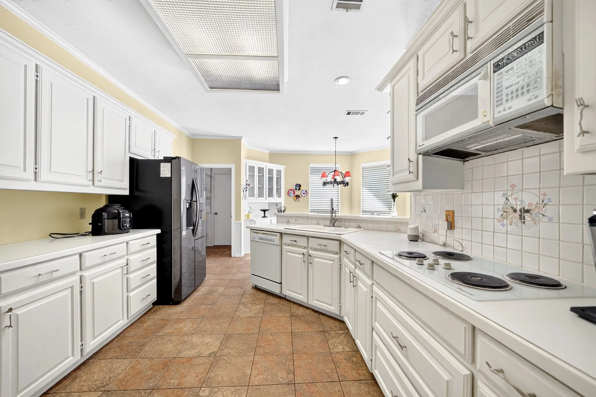 White cabinetry with silver-tone hardware