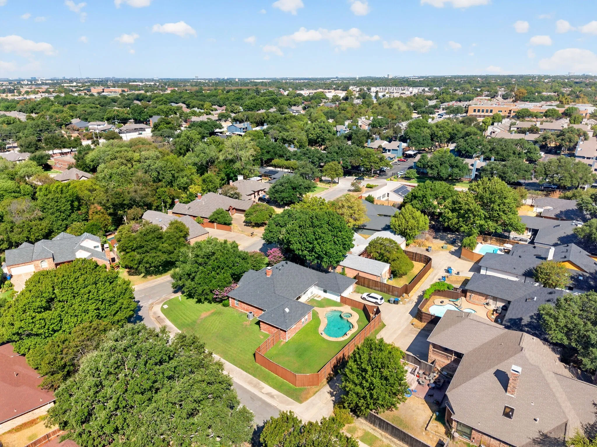 Residential property featuring a private pool and fenced backyard