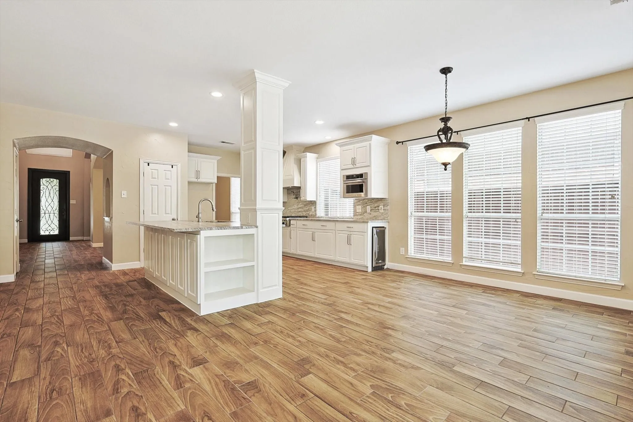 The gorgeous open floor plan sets a welcoming tone for entertaining or family fun.