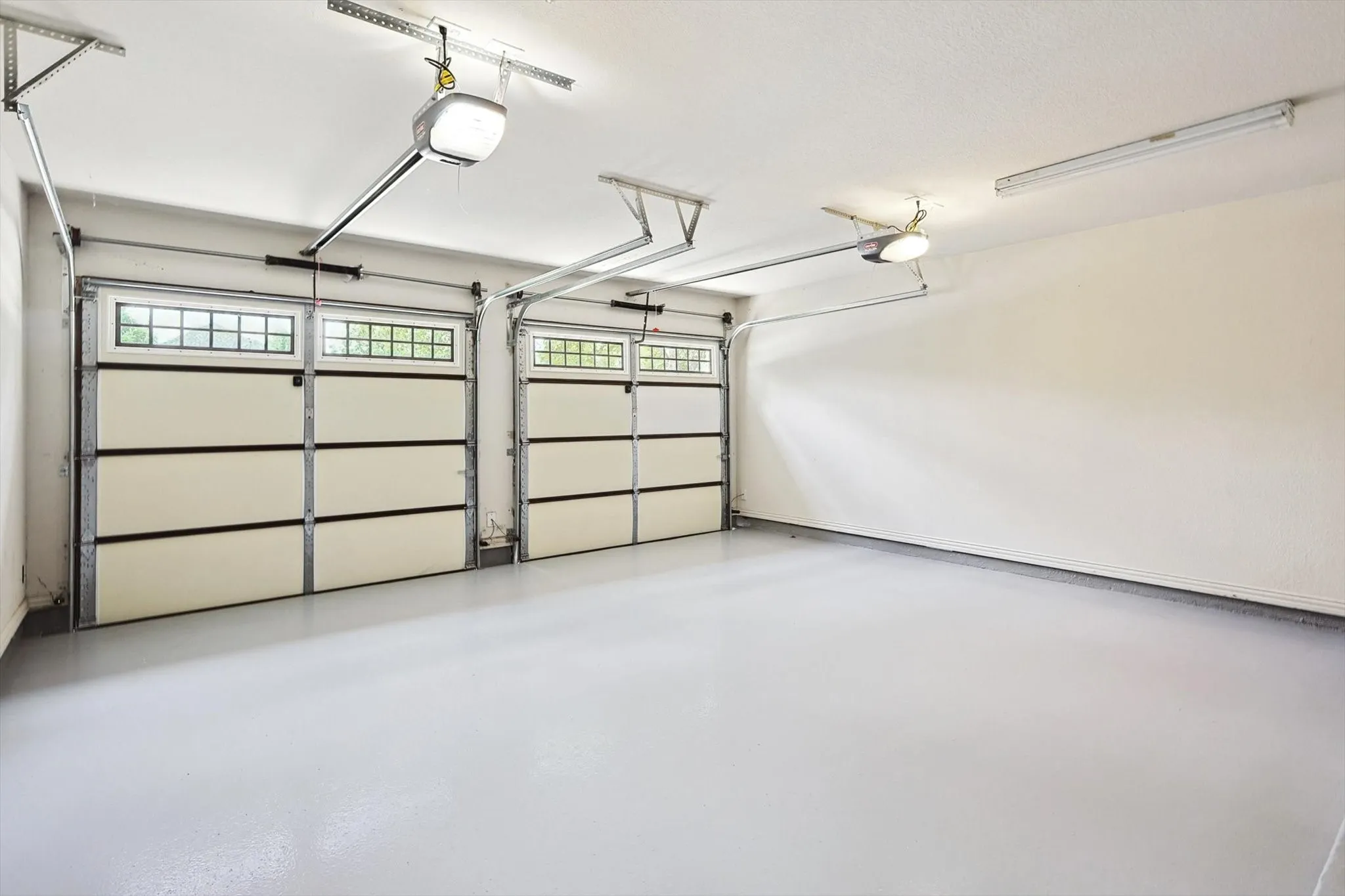 The 2 car garage features epoxy flooring.