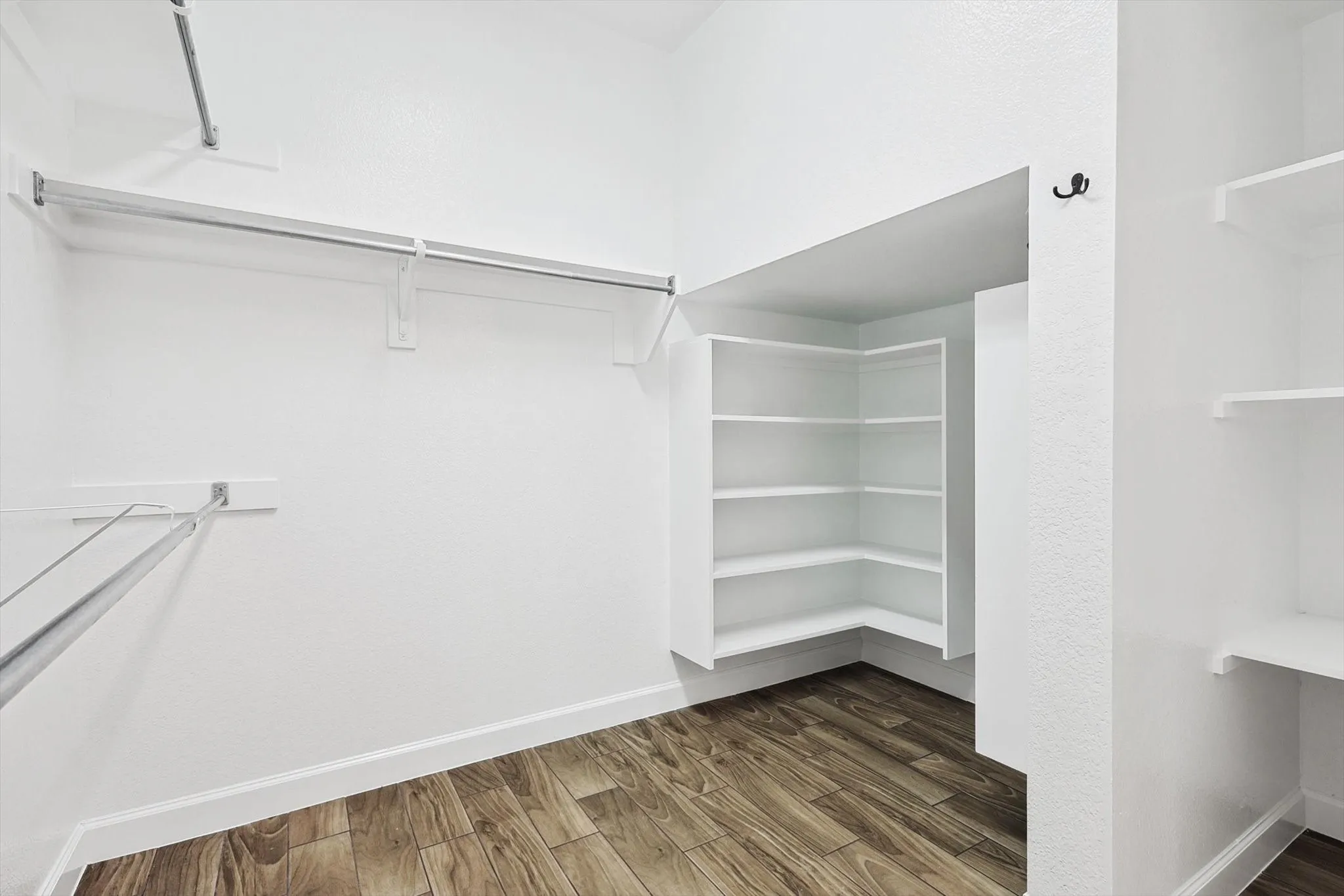 The primary bedroom includes a spacious walk in closet.