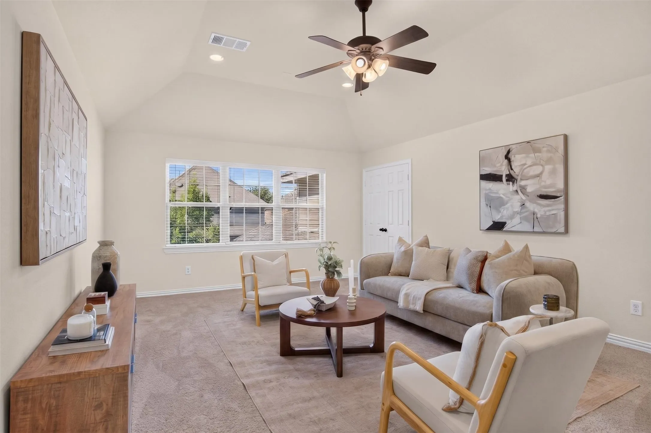 Vaulted ceiling with recessed lighting and ceiling fan