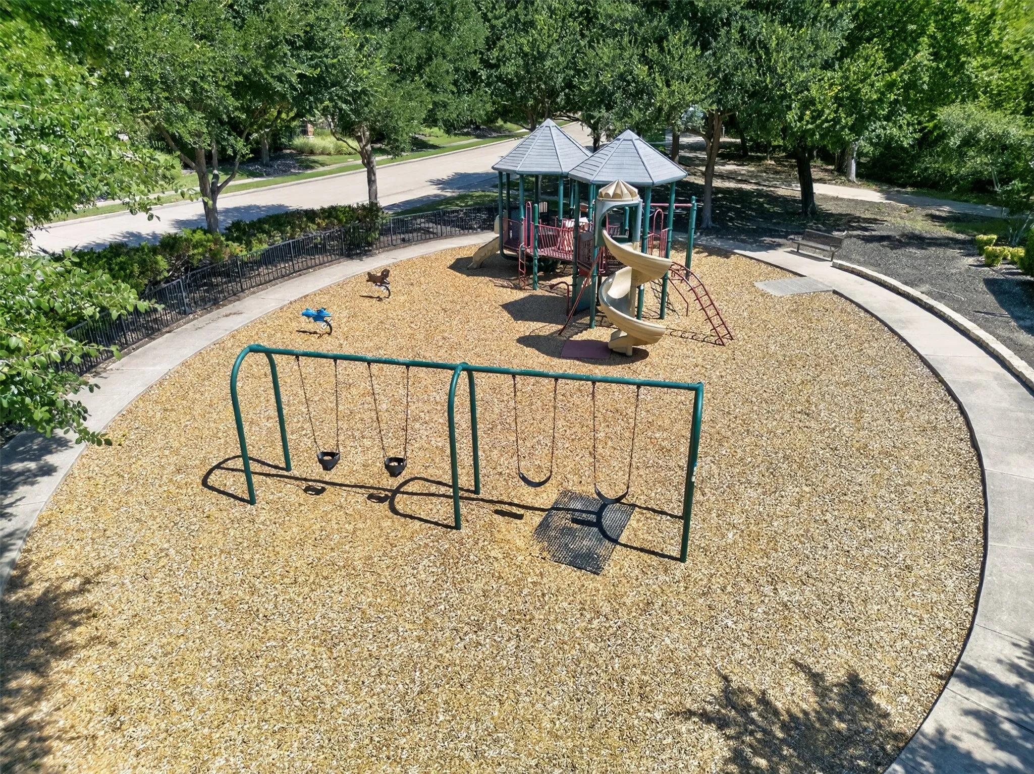 Playground area featuring swings, slides, and climbing structures