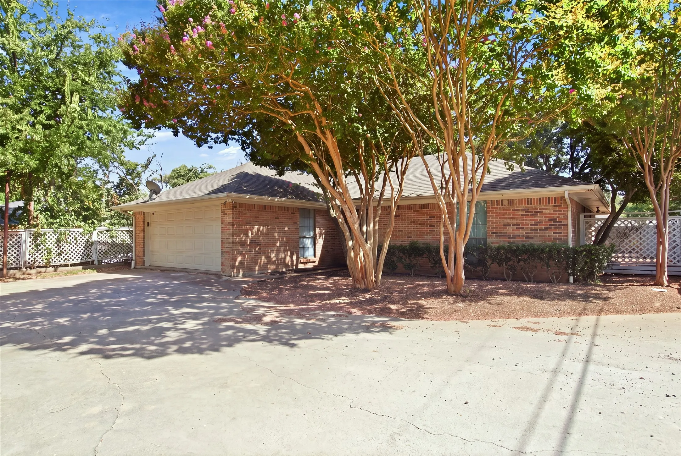 Brick exterior with a gabled roof and attached garage