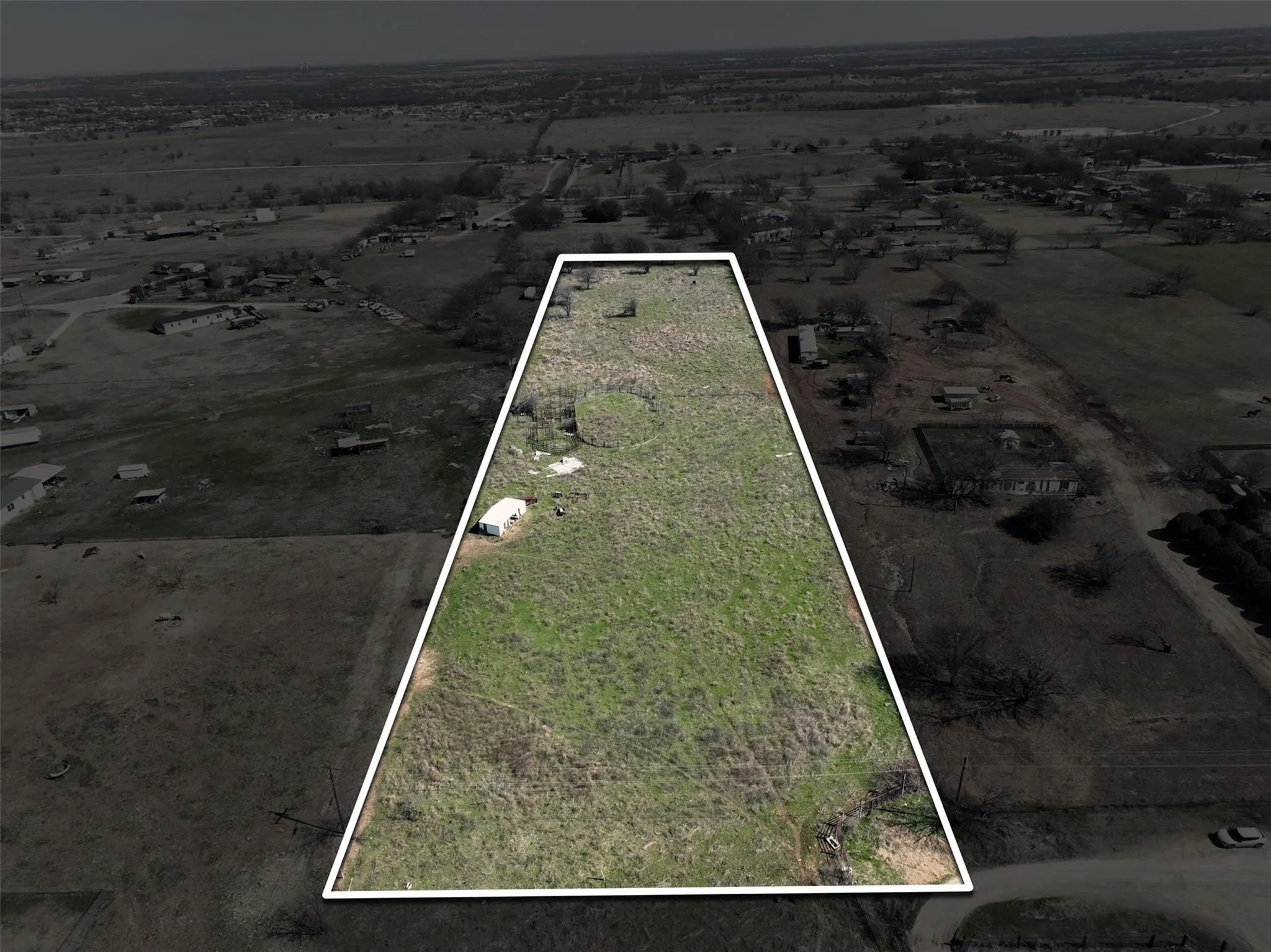Expansive undeveloped land parcel featuring natural ground cover