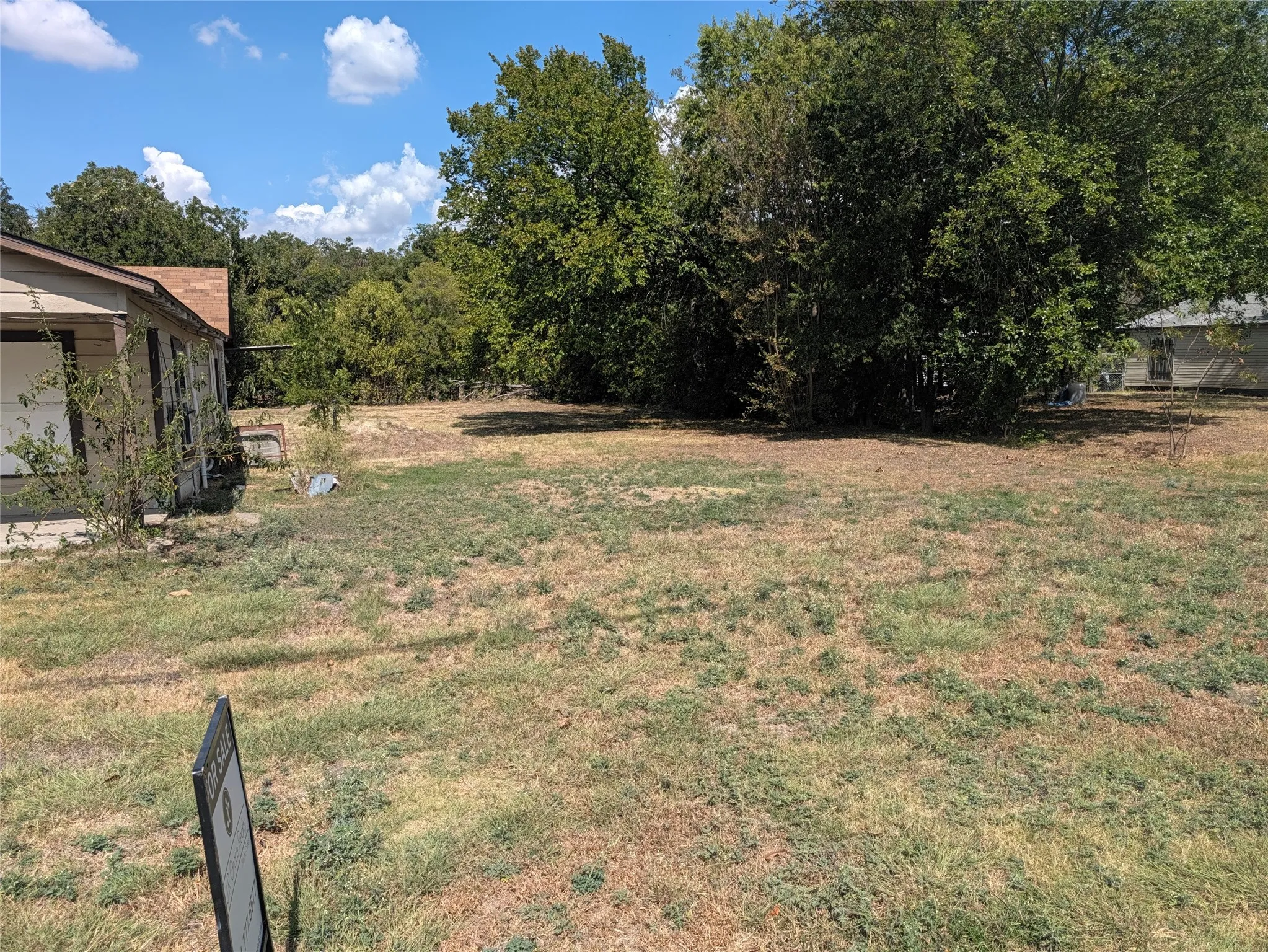 Expansive lot featuring a natural landscape and mature trees