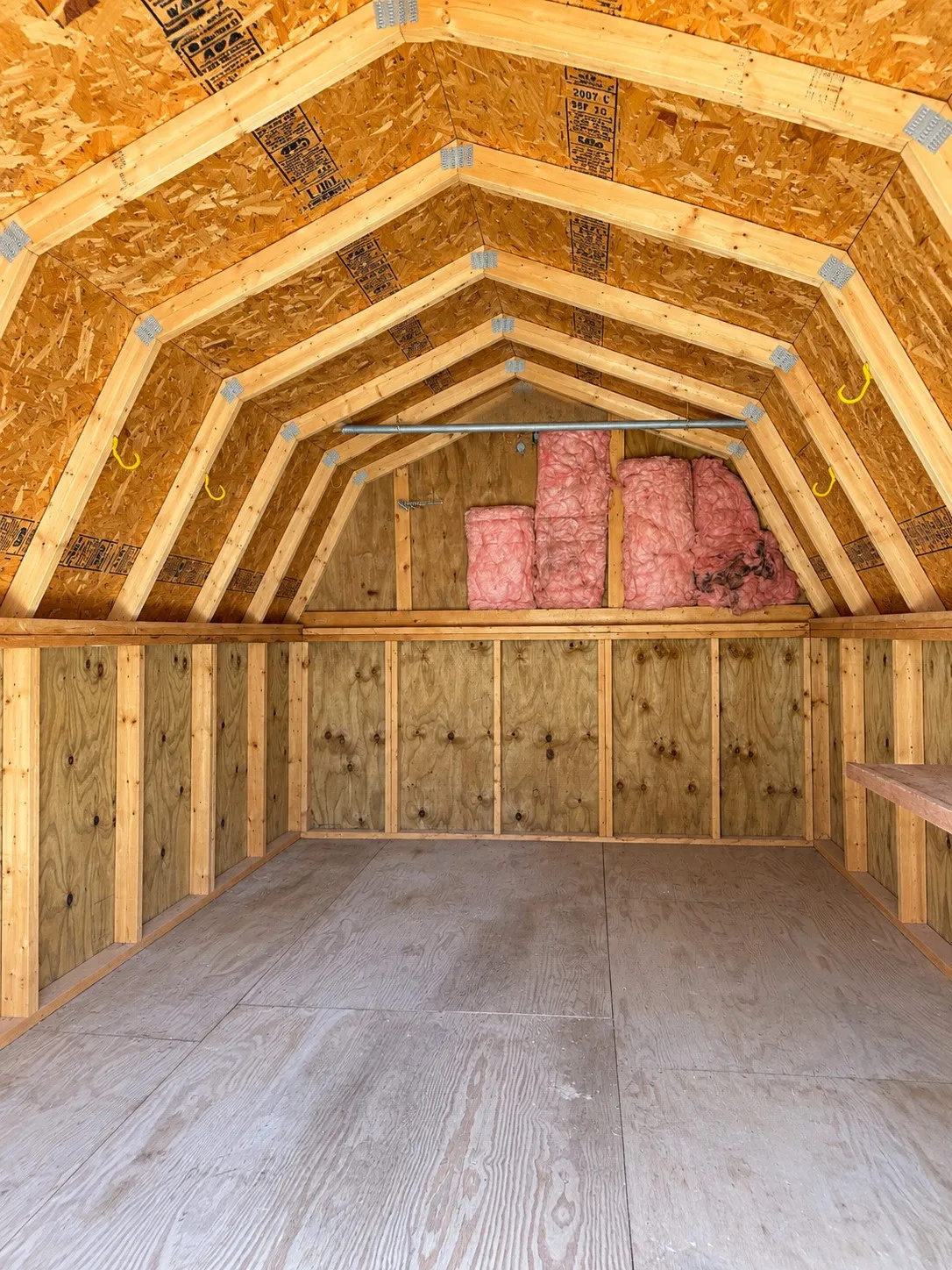 Vaulted wood-paneled ceiling with exposed beams