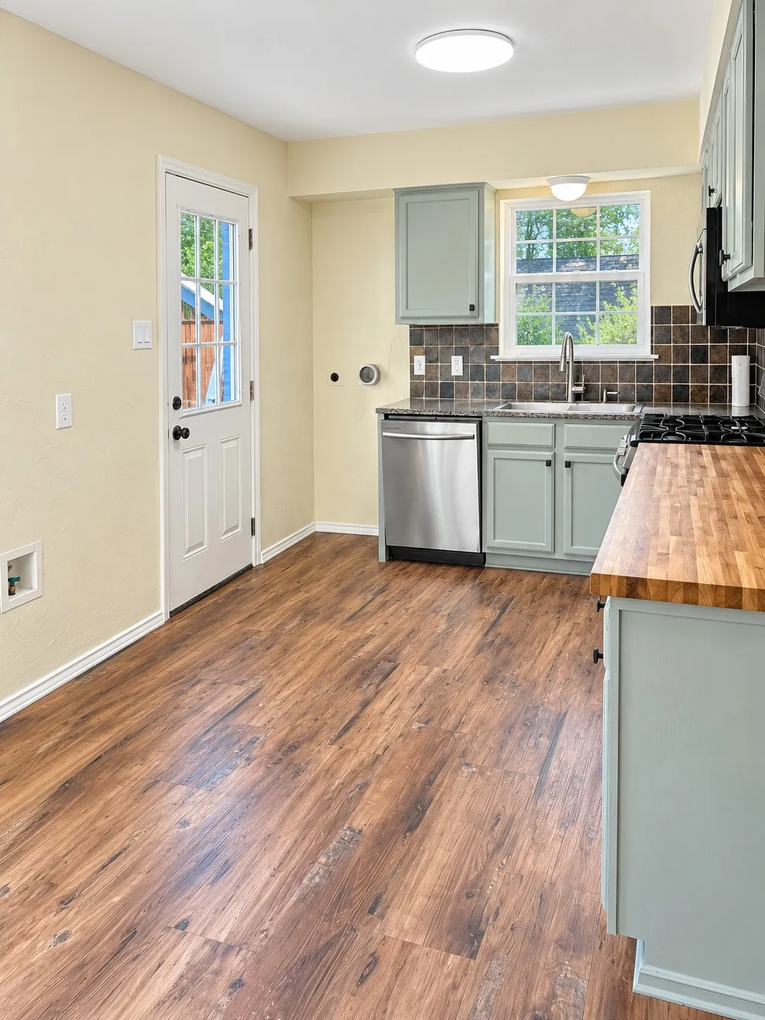 Wood-finish flooring throughout, complemented by light-toned wall paint