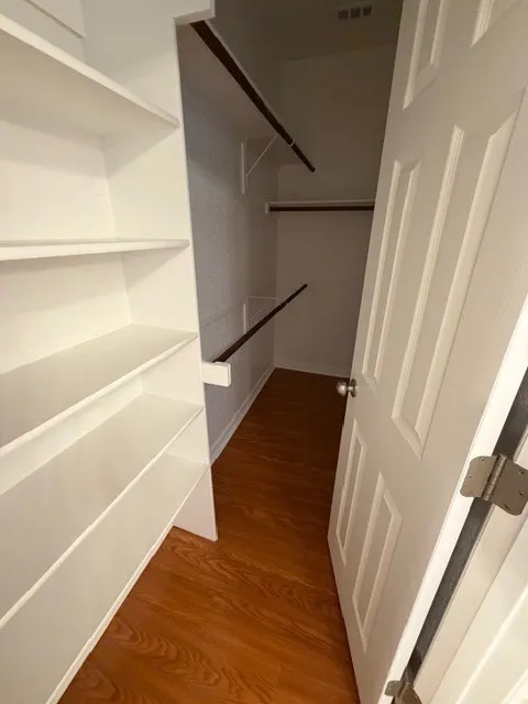 White panel door and wood-finish flooring