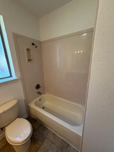 Bathtub with integrated shower, showerhead, and faucet