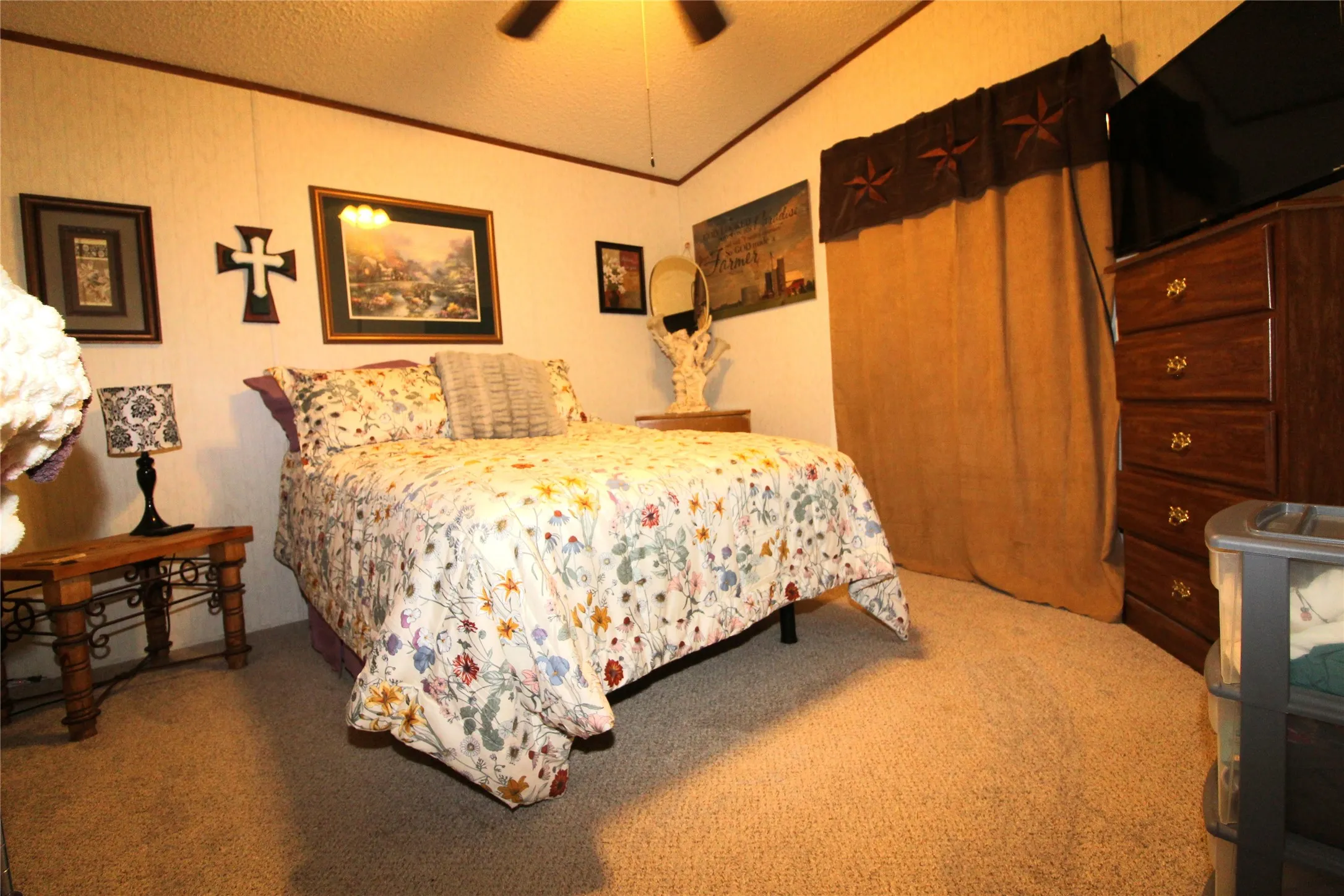 Carpeted flooring, vaulted ceiling, and ceiling fan