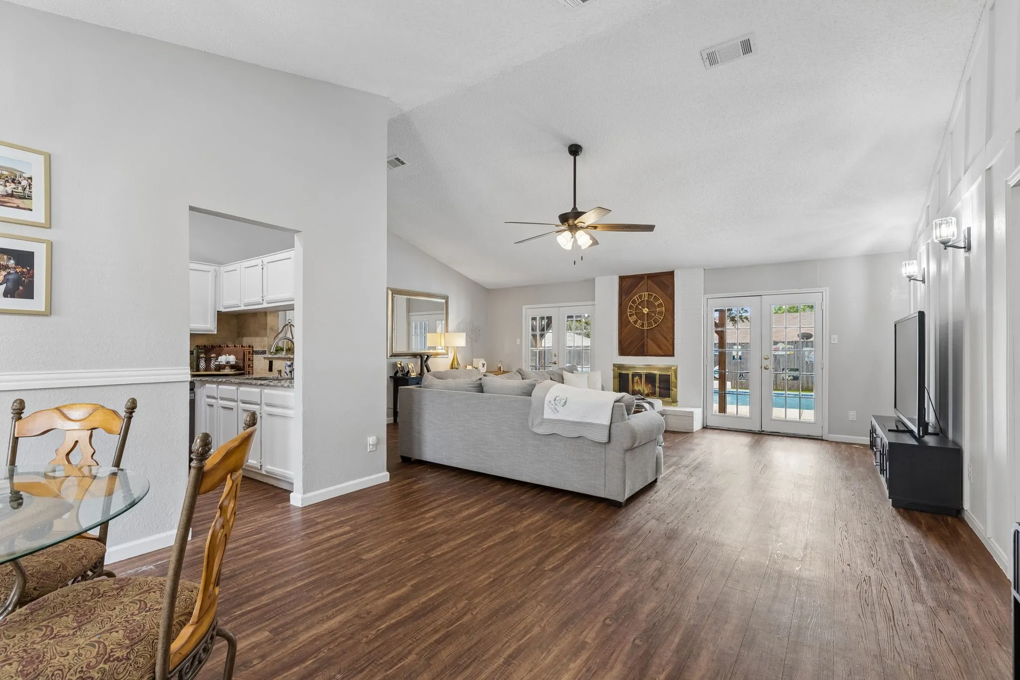 Entry with view of dining area, kitchen and living room