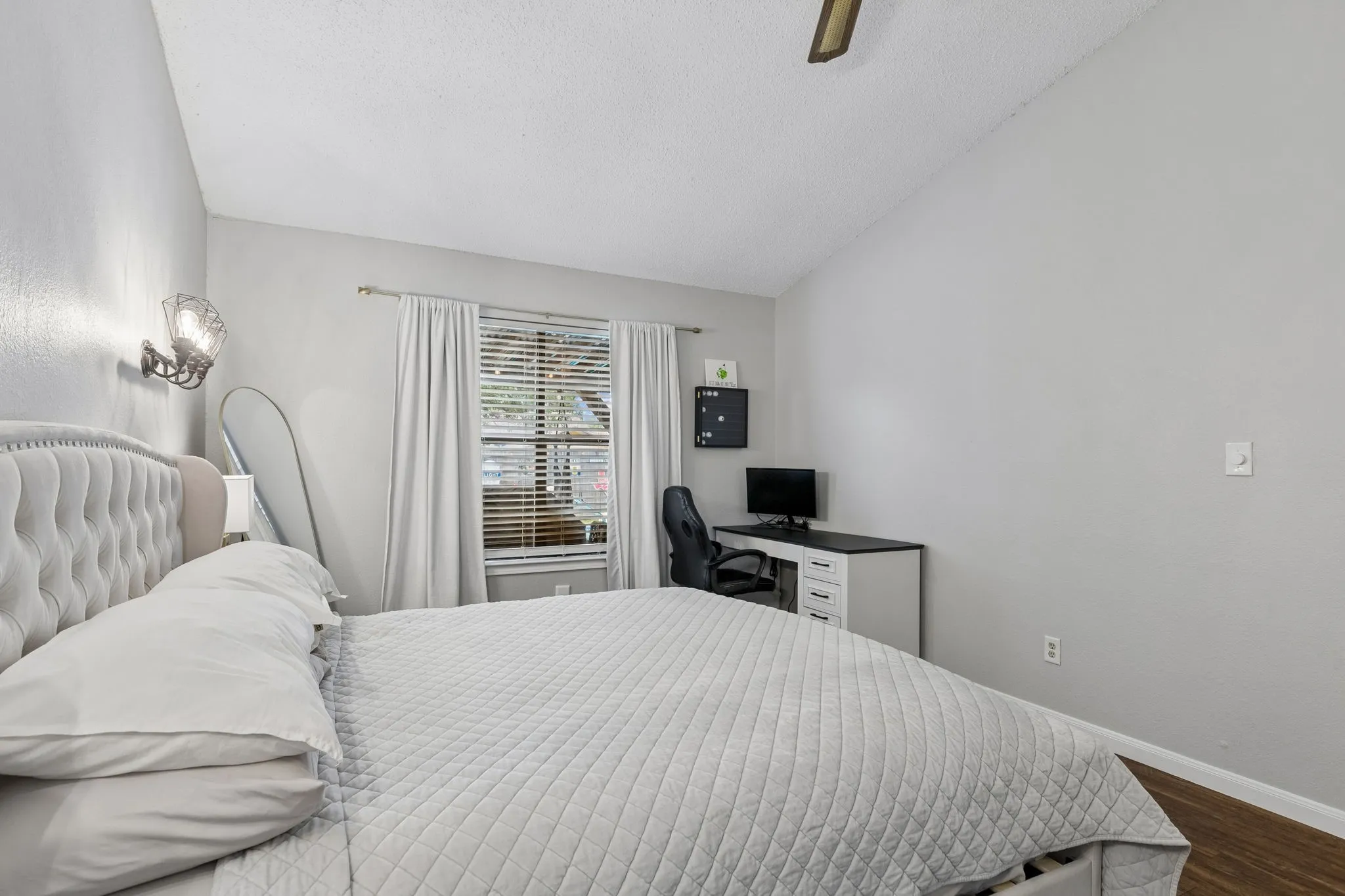Primary suite with view of back patio and pool