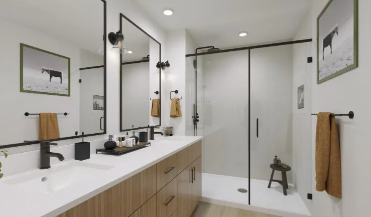 Bathroom featuring a shower stall, double vanity, and recessed lighting