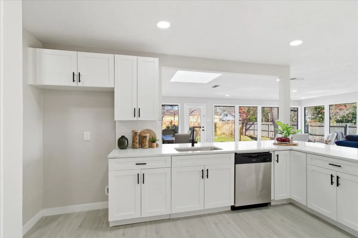 White shaker cabinetry with matte black hardware