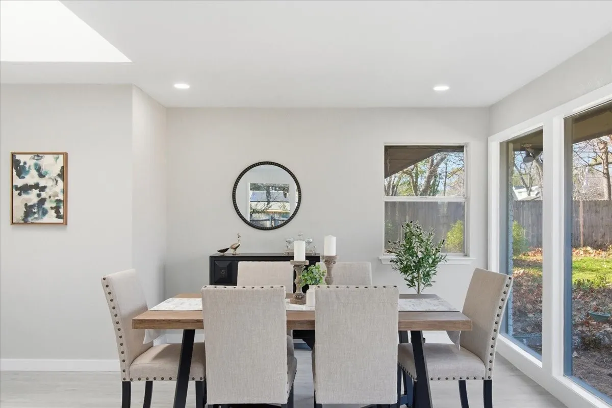 Recessed lighting, skylight, large windows, wood-finish flooring