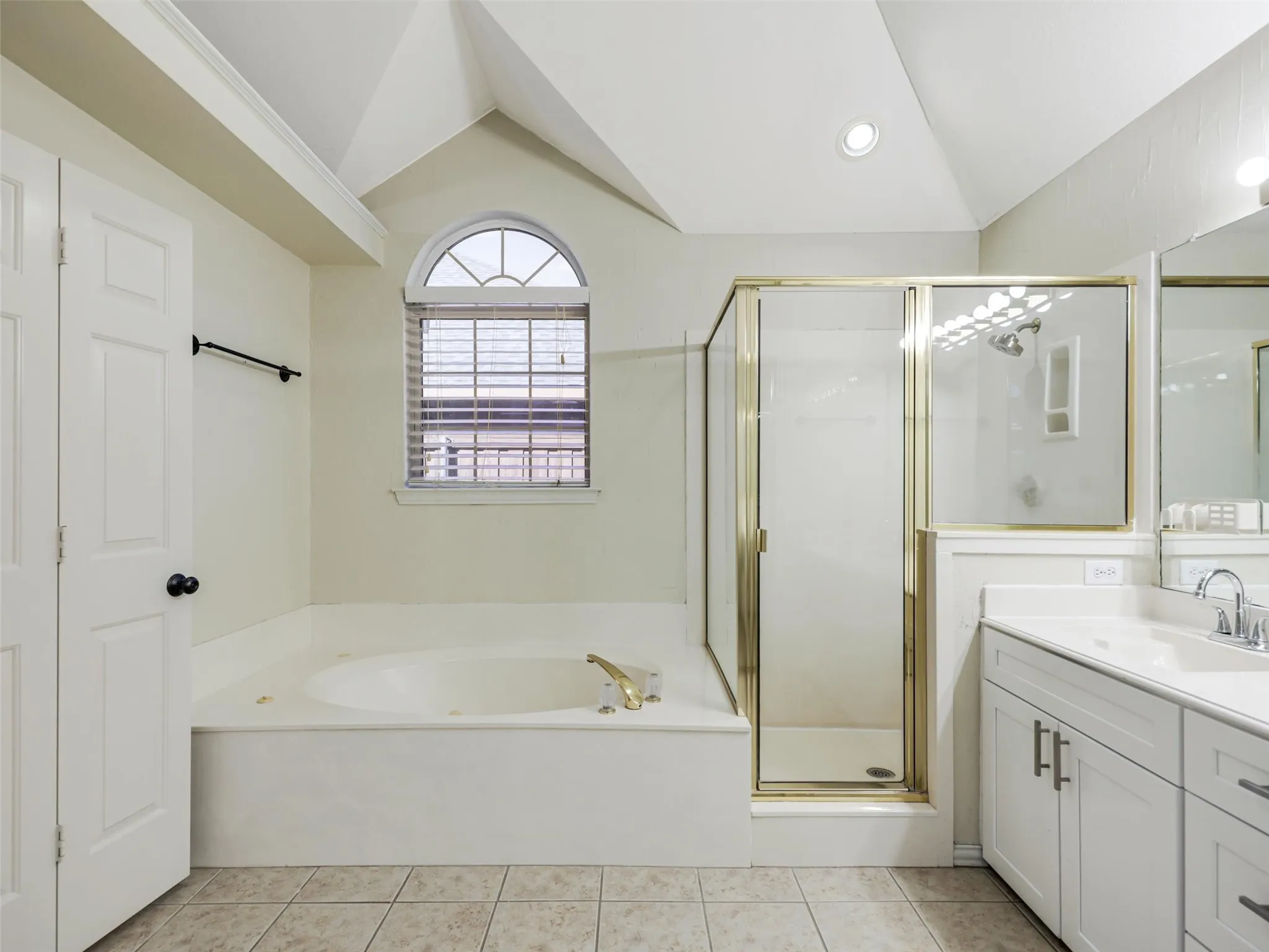 Tiled flooring and vaulted ceiling