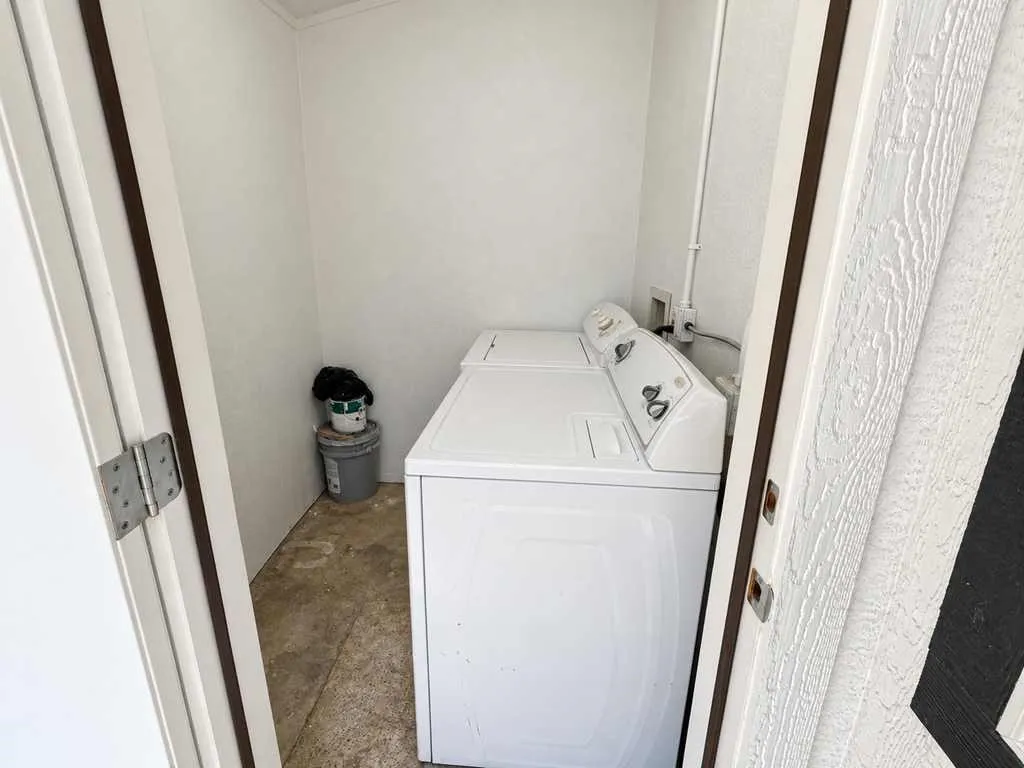 Second home laundry area showing washer and dryer placement.