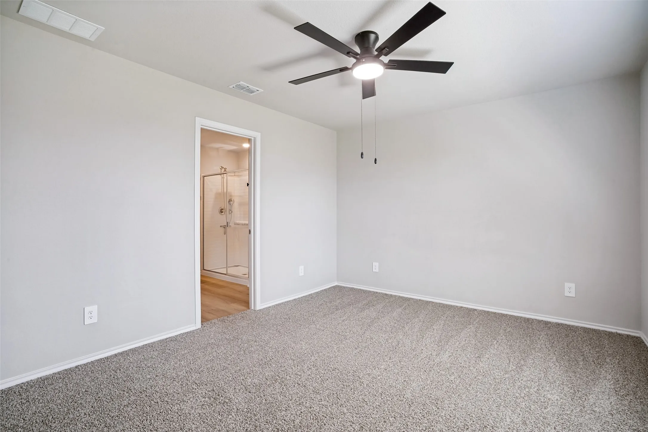 Neutral-toned carpeting paired with light gray wall finishes