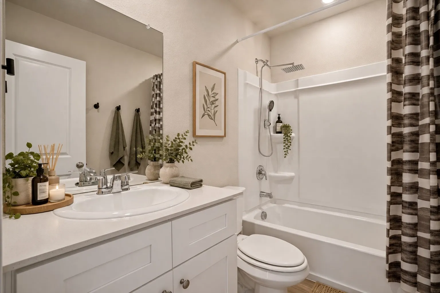 White shaker-style vanity with an integrated sink and chrome fixtures