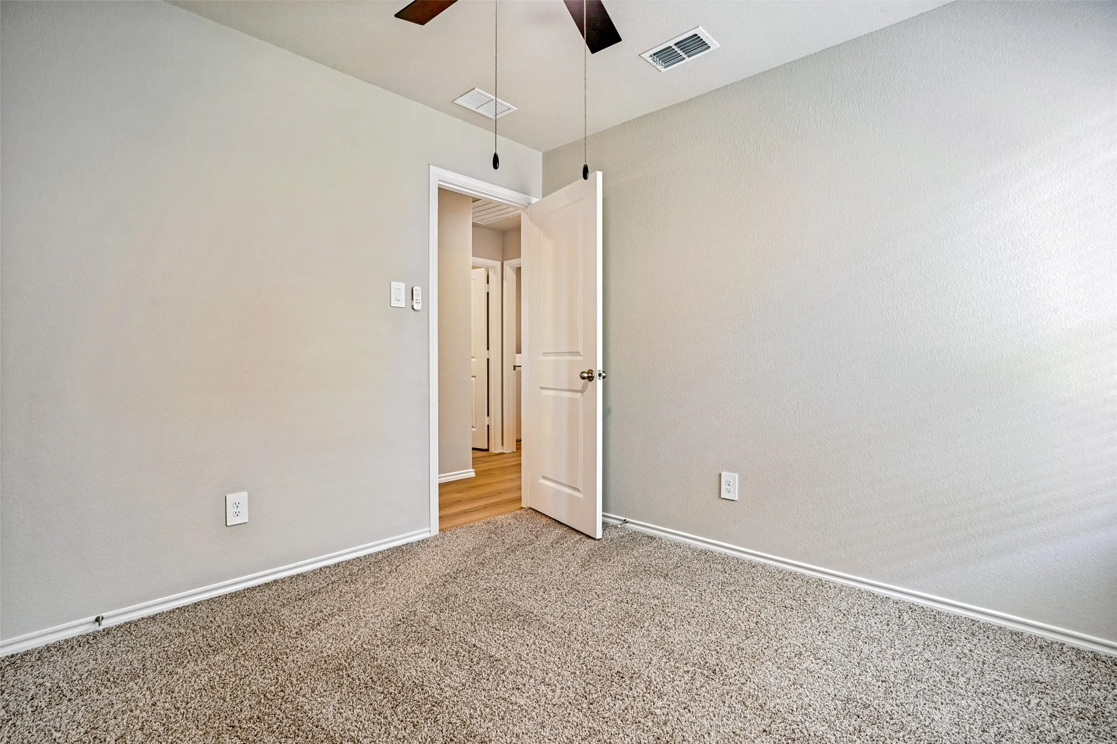 Neutral wall color with white trim