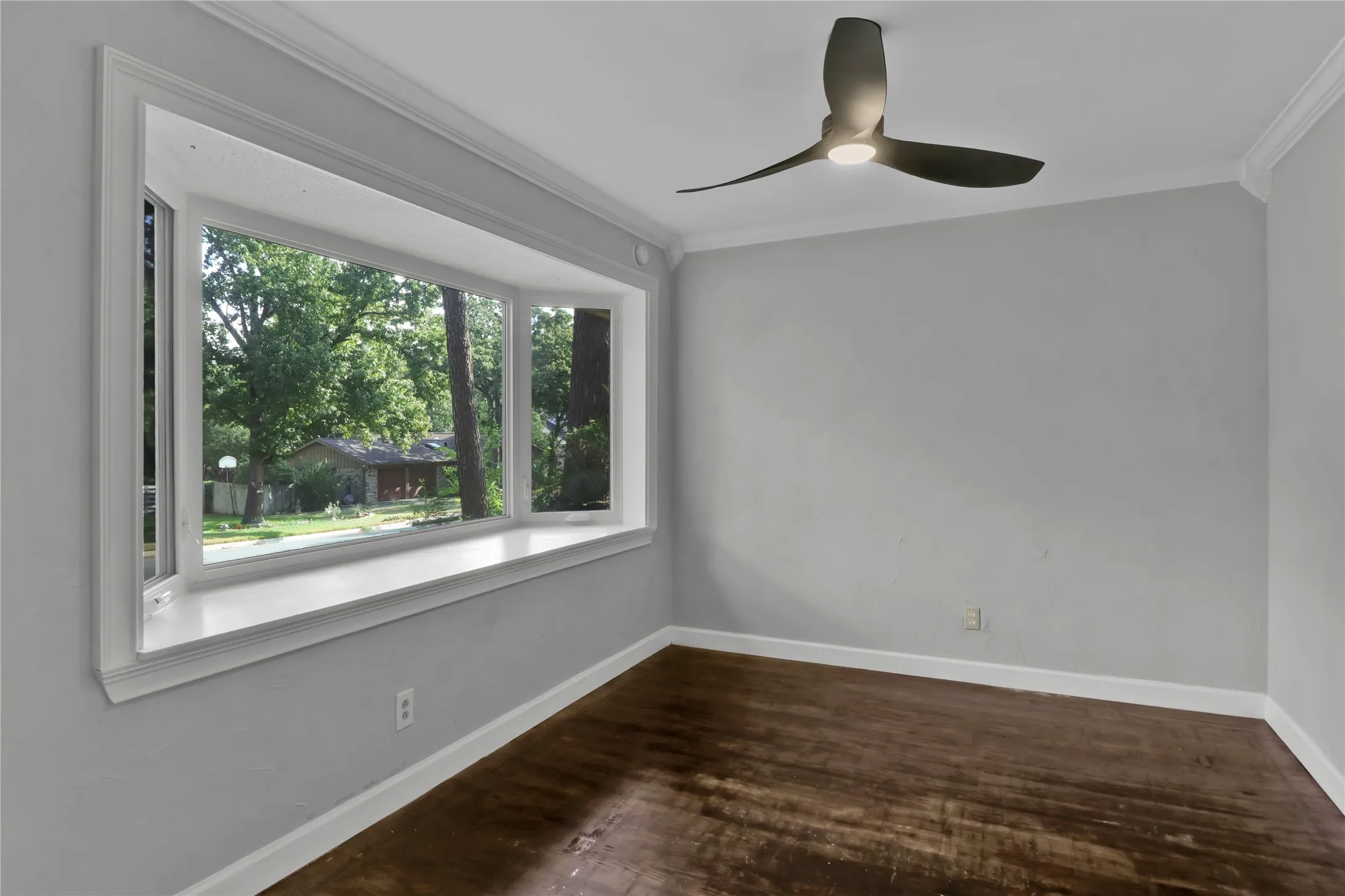 Formal Dining just off kitchen overlooks front yard.