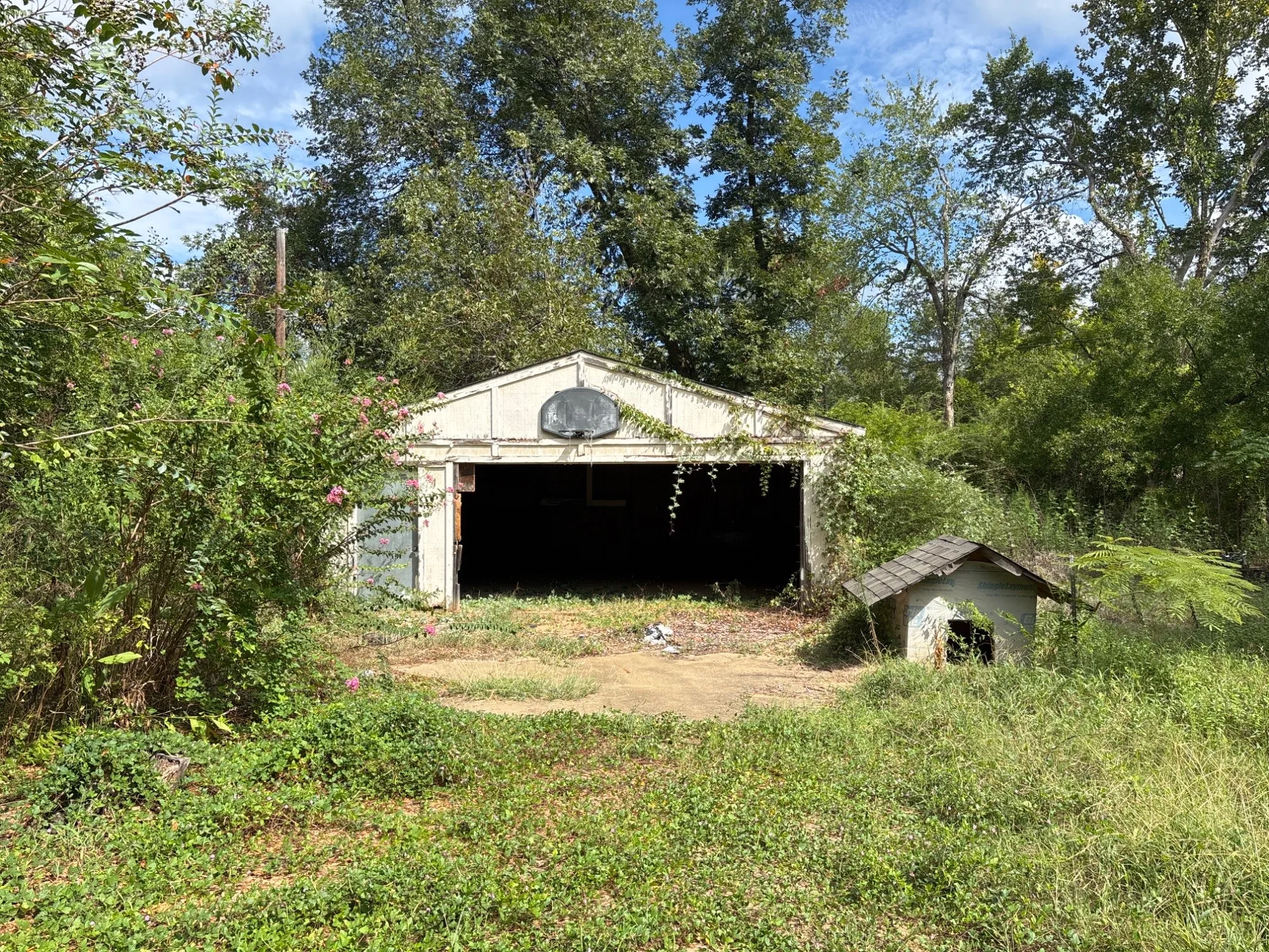 Secondary detached outbuilding / barn structure set on open acreage grounds.
