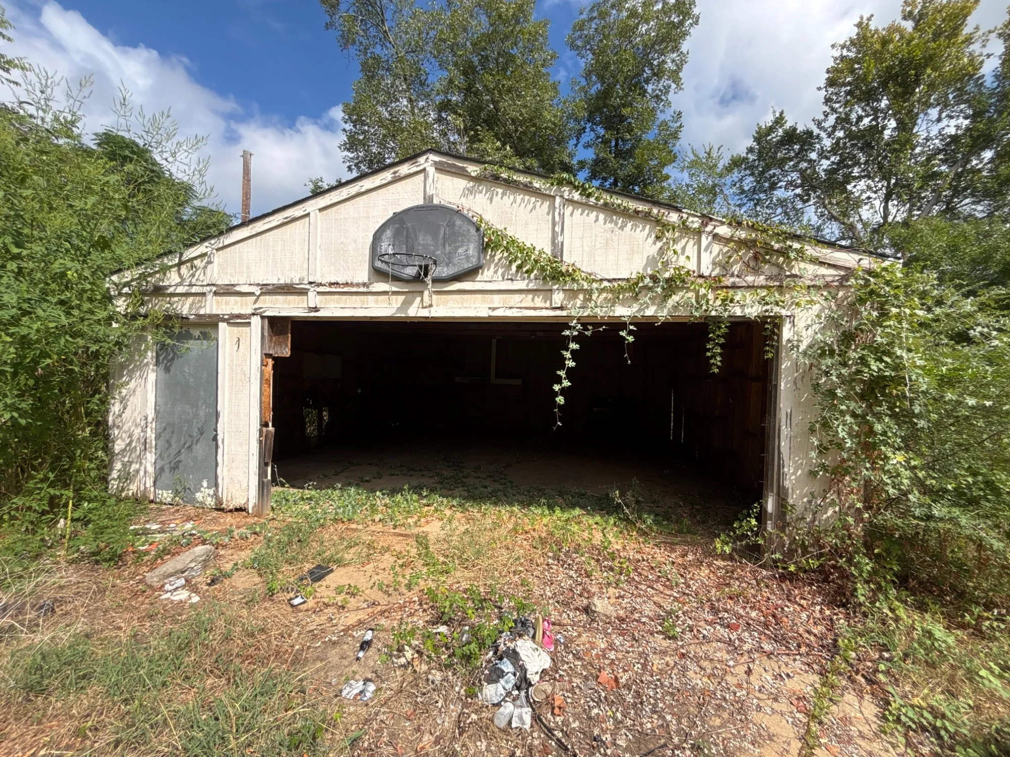 Detached two-car garage structure providing covered parking and shop space.