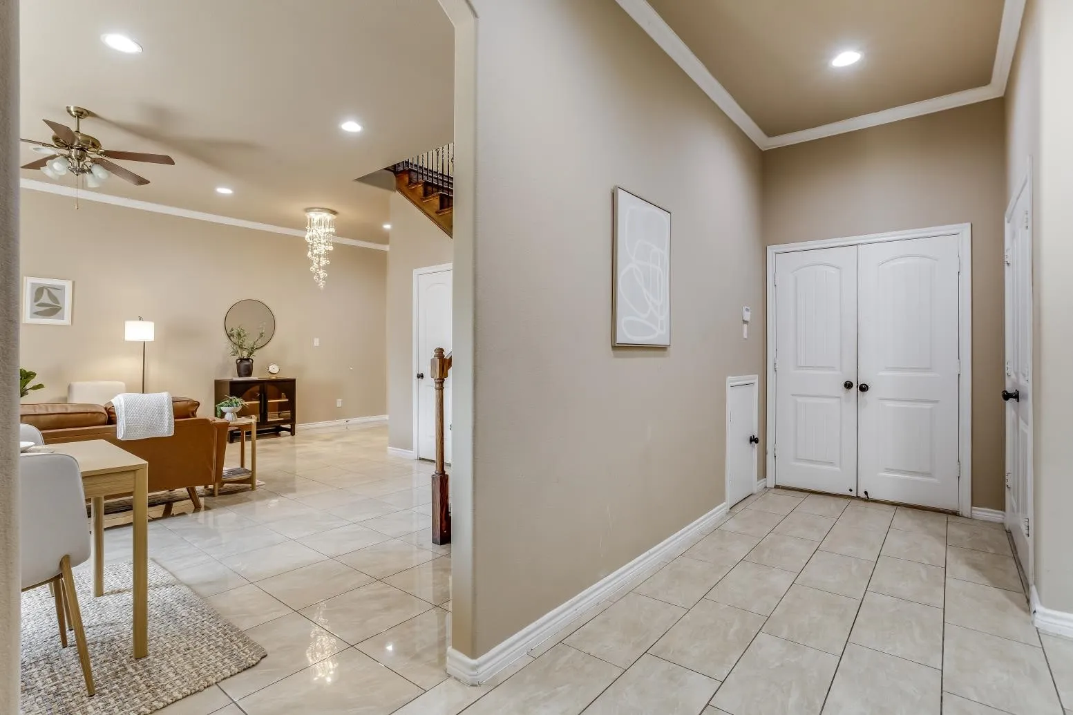 Recessed lighting, crown molding, and tiled flooring