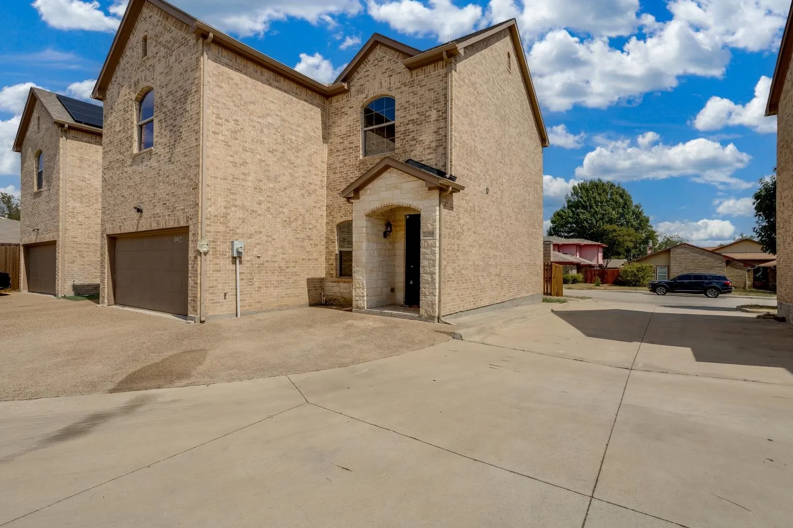 Brick exterior with a stone-accented entry