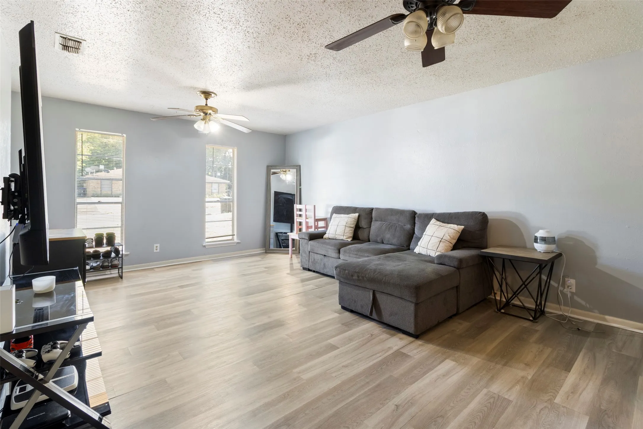 Light wood-finish flooring with neutral wall tones