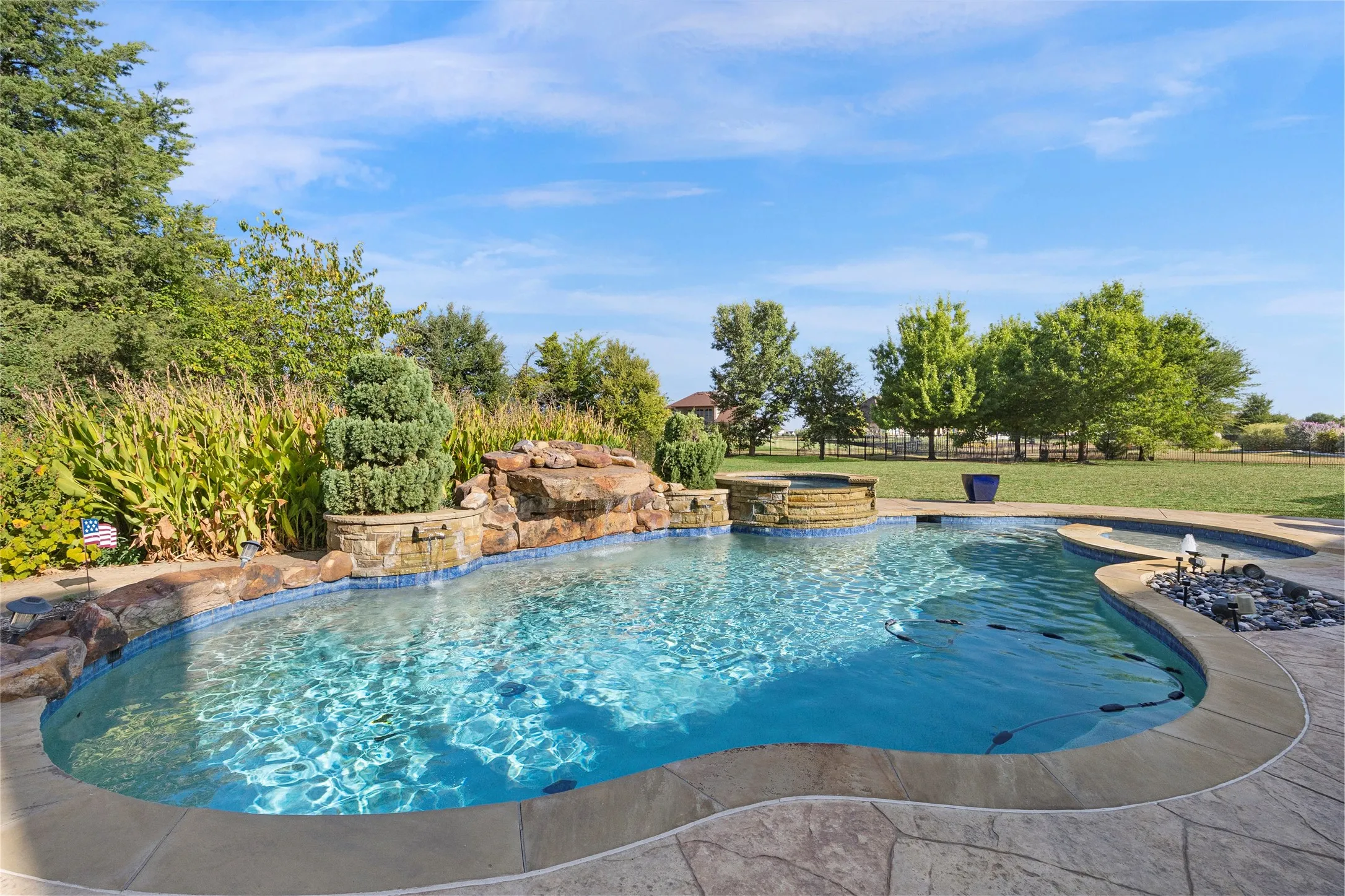 Beautiful pool with waterfall and hot tub
