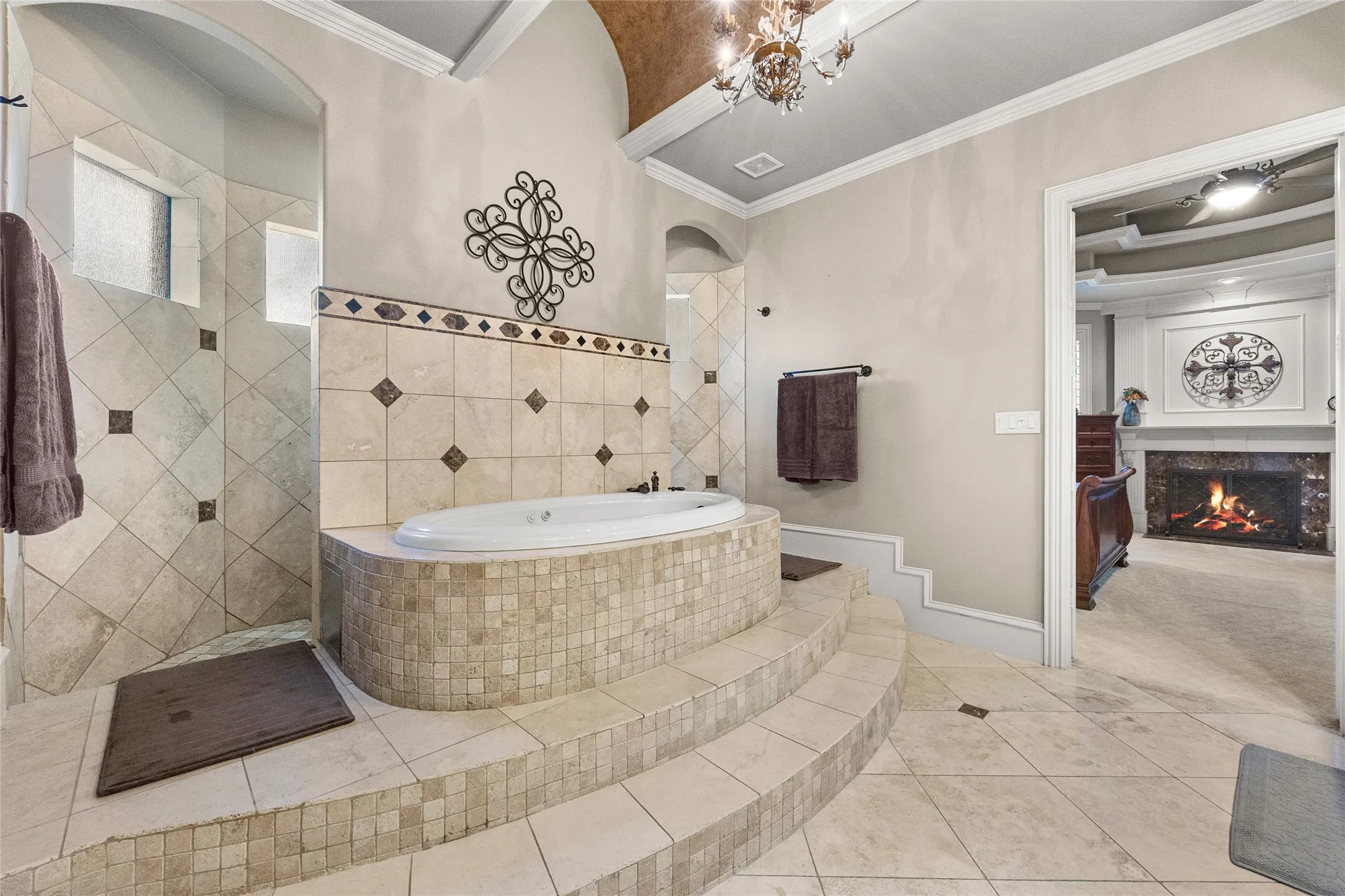 Primary bathroom with large jetted tub and double shower