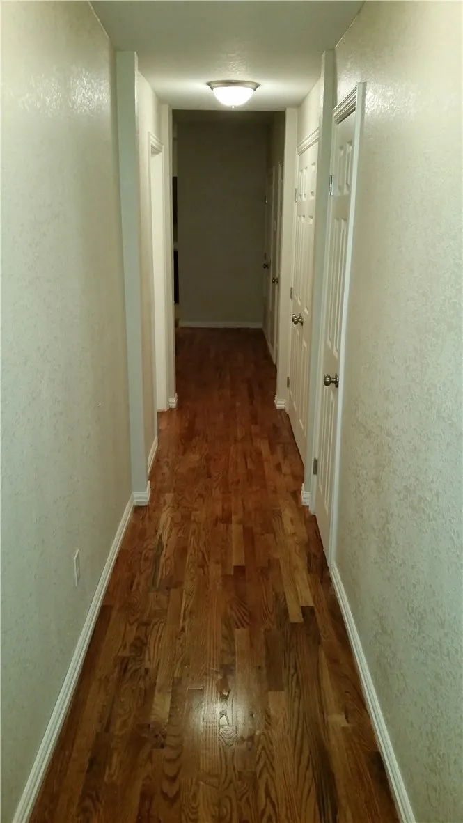 hallway from front door towards bedrooms and living room