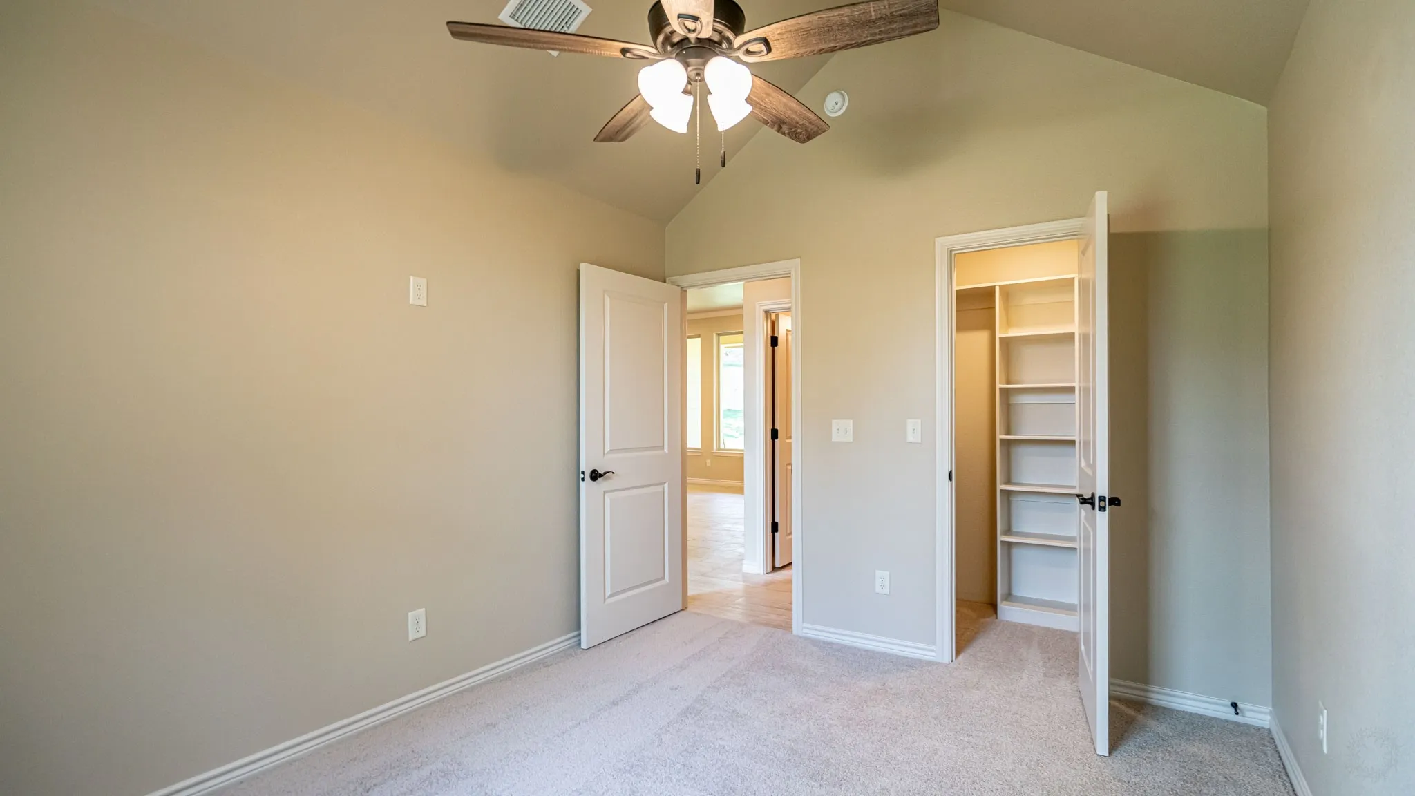 Secondary bedroom with walk in closet