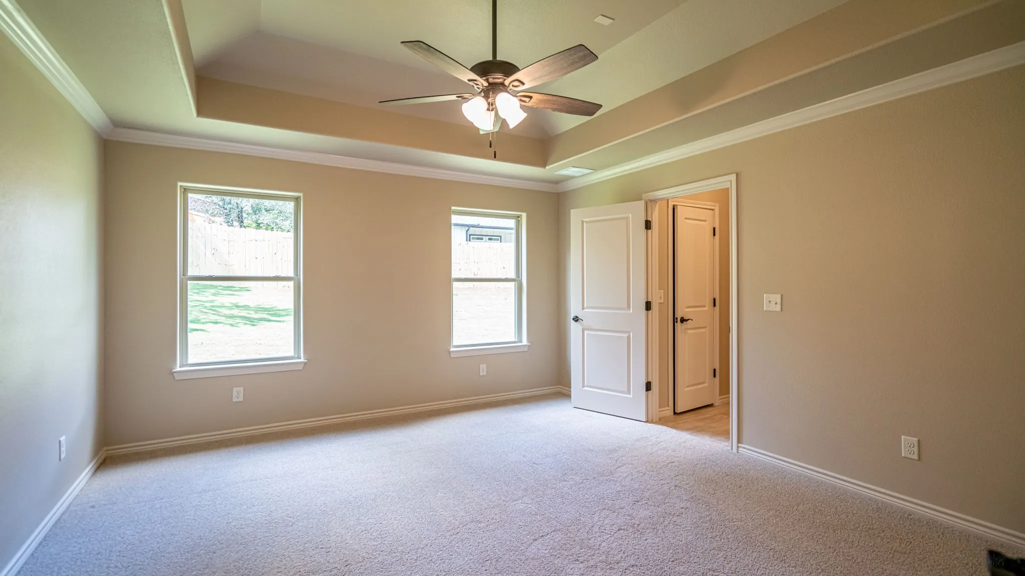 Primary bedroom with ensuite bath and walk in closet