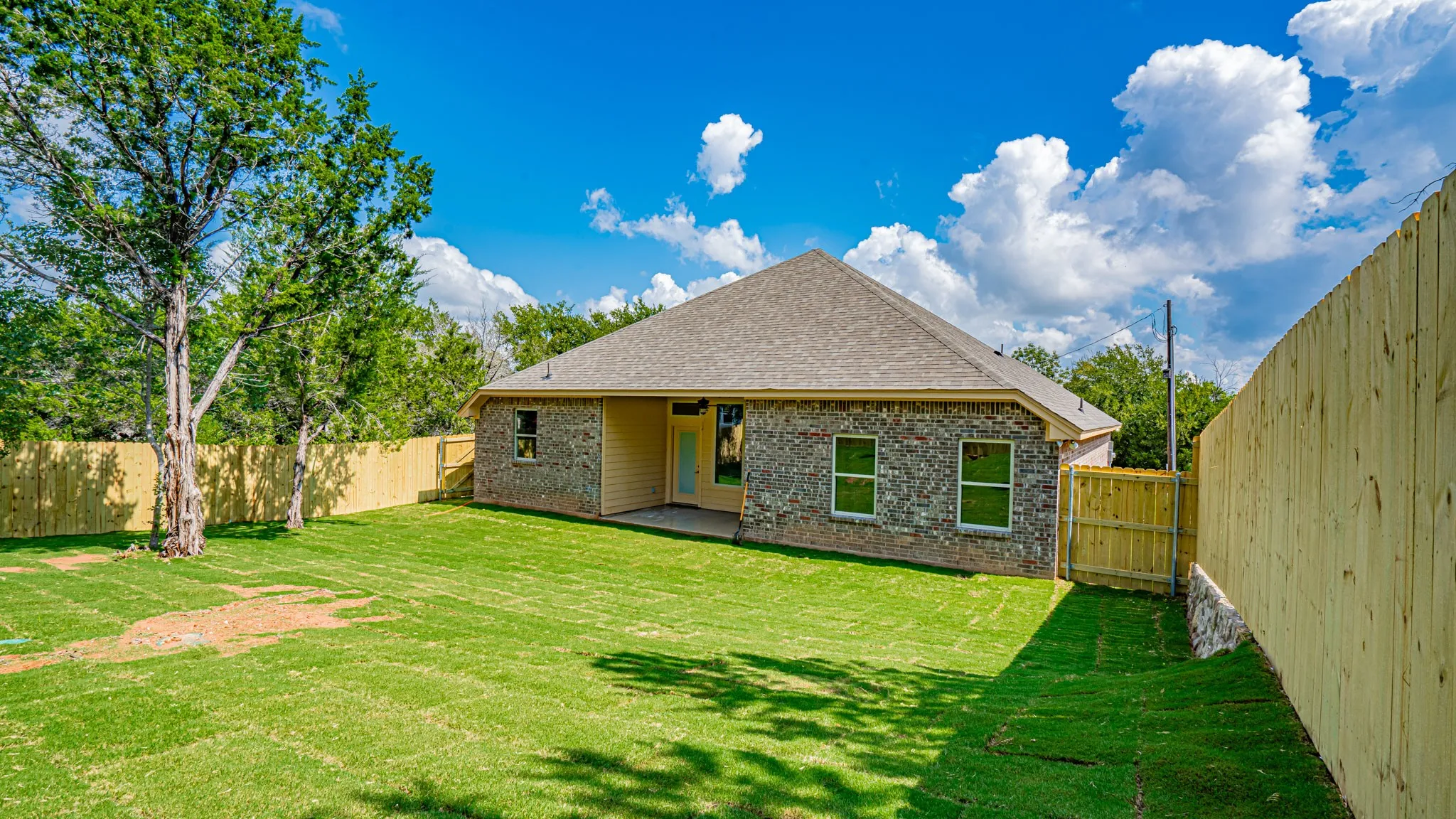 Large backyard with privacy fence