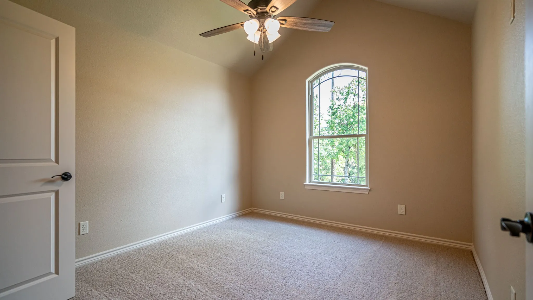 Secondary bedroom with carpet and ceiling fan