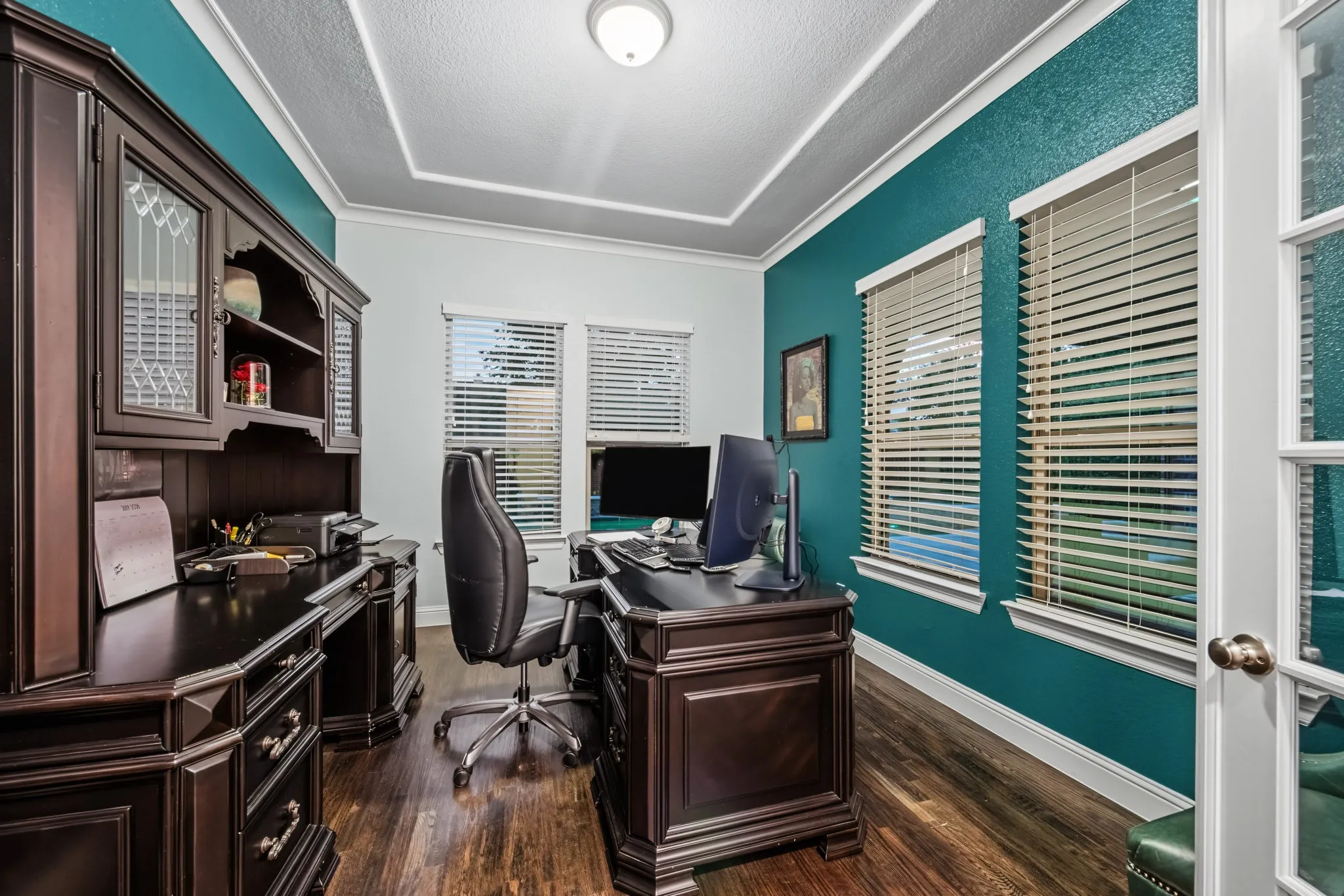 The Home Office looks out to the pool & patio area!