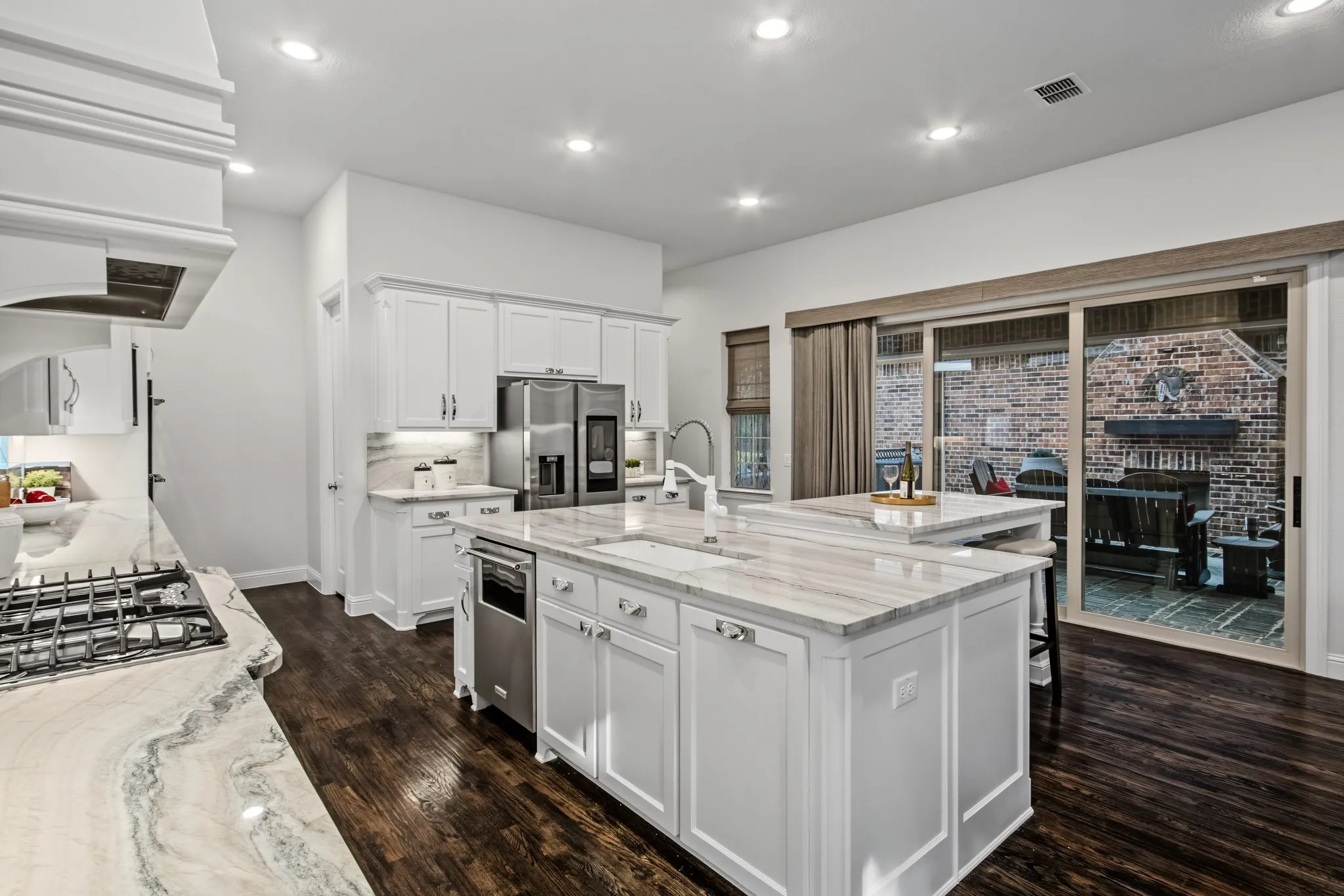Panoramic glass doors open to the courtyard with outdoor​​‌​​​​‌​​‌‌​‌‌​​​‌‌​‌​‌​‌​​​‌​​ fireplace!