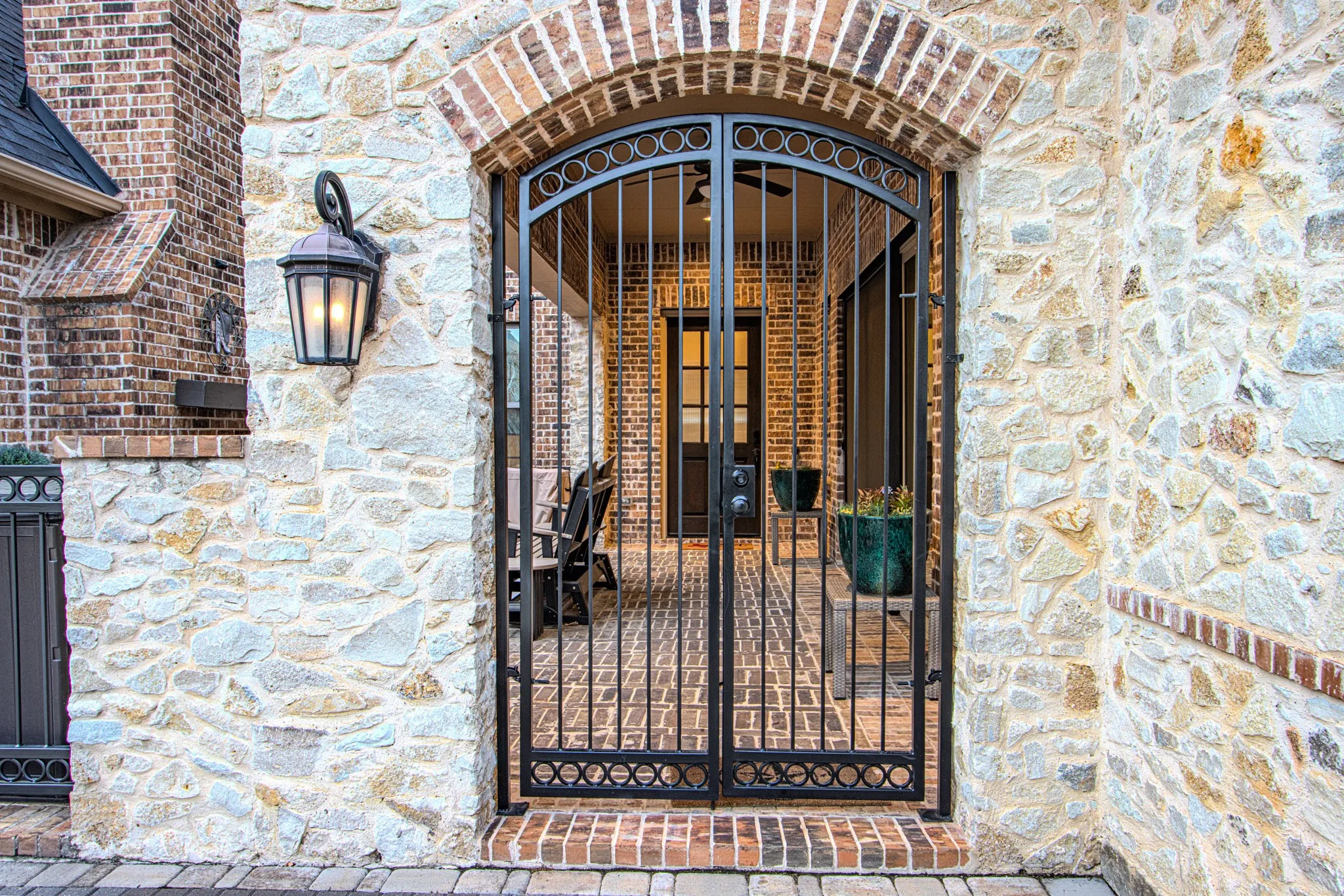 Wrought-iron entry gate into the front courtyard.