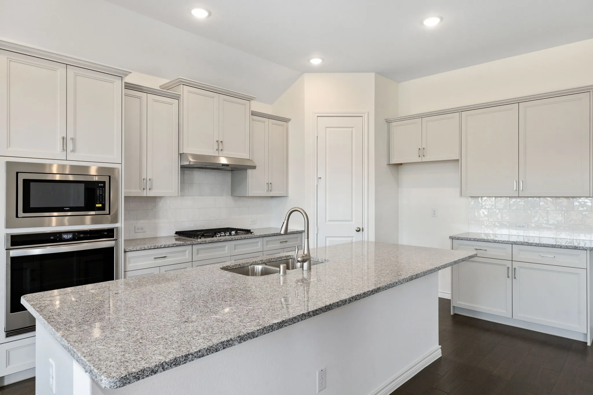 The stylish kitchen at 5013 Long Pond Trail is definitely the heart of this gorgeous home!