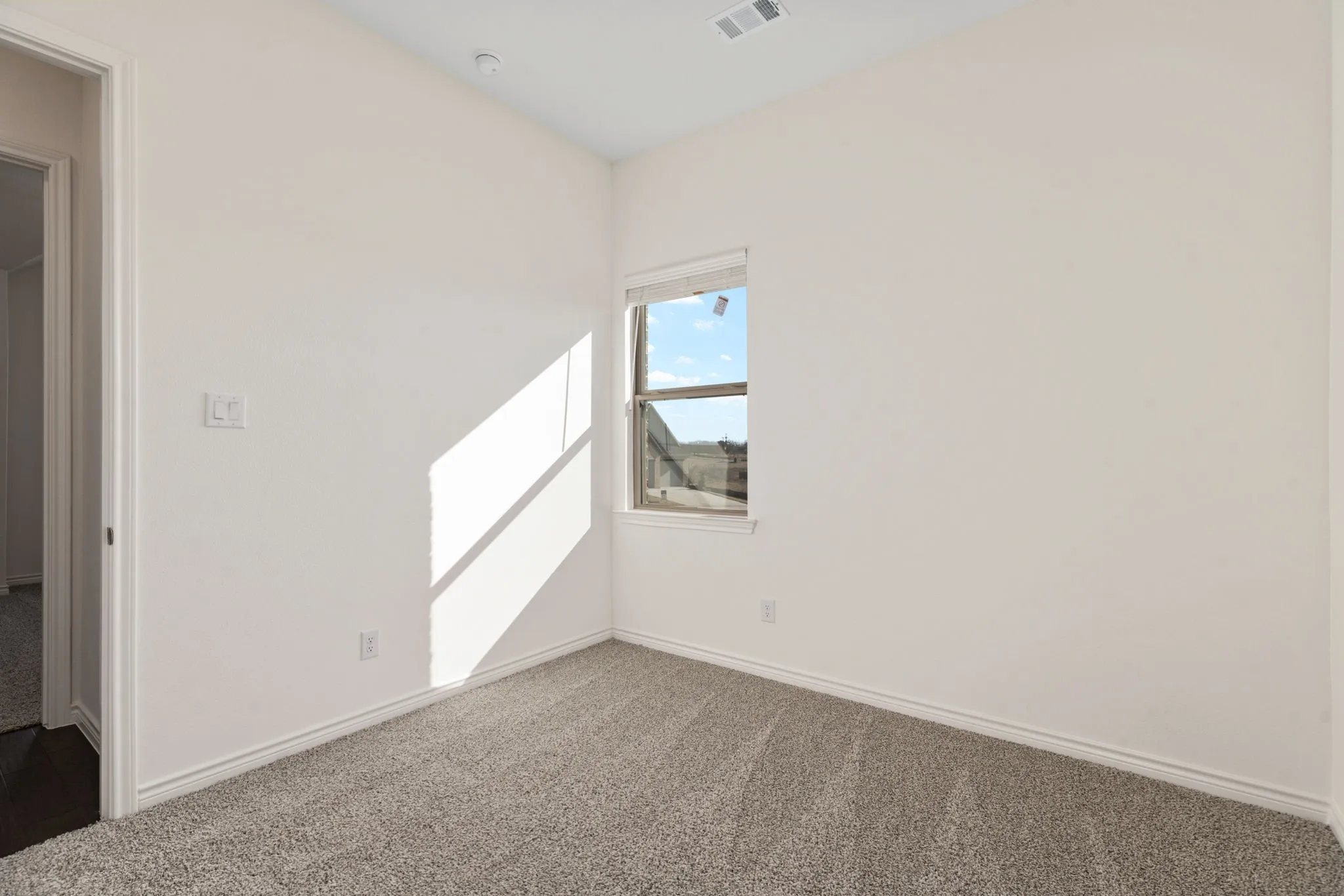 The secondary bedrooms are generously sized, each with their own design features.