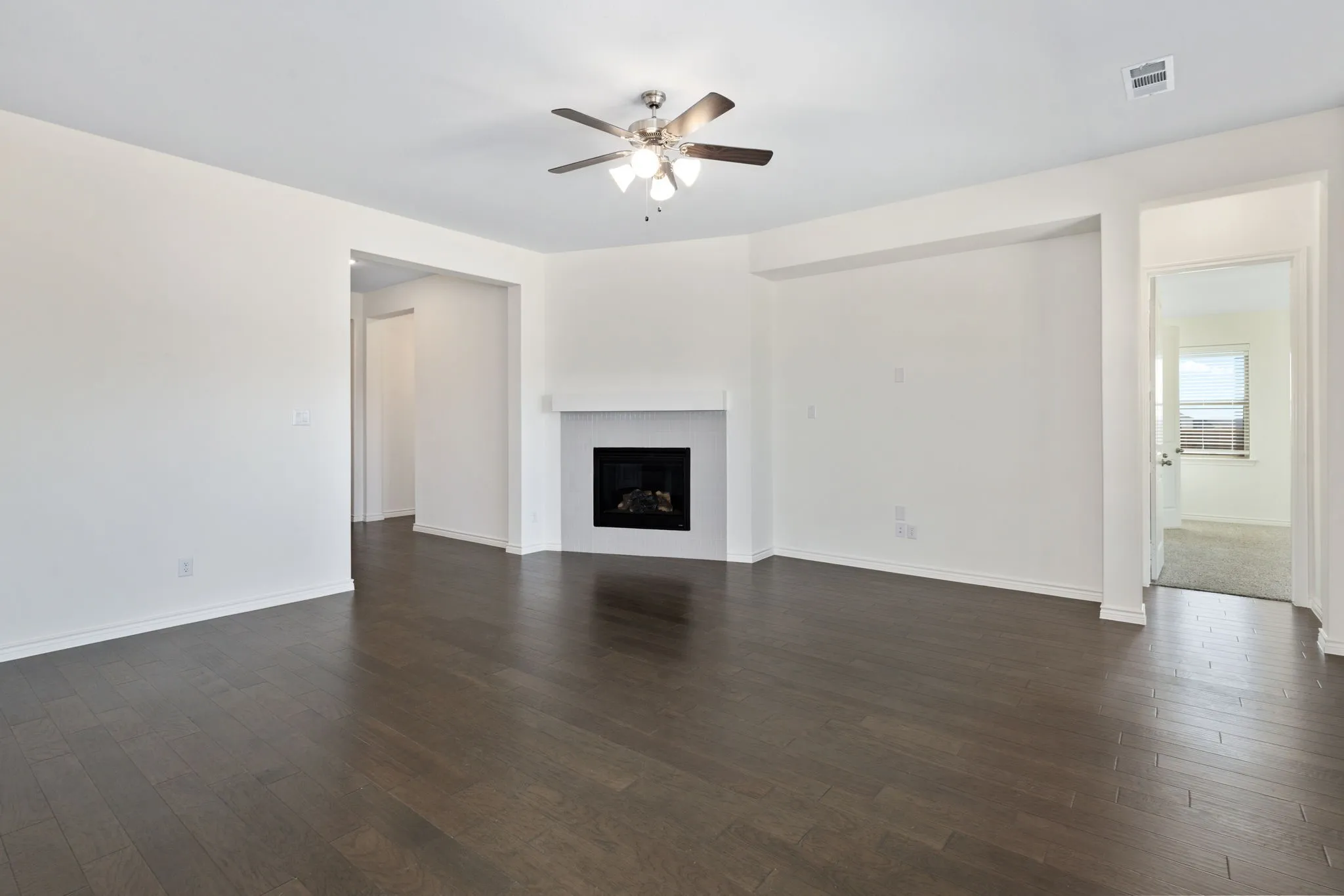 The family room is anchored by a fireplace.