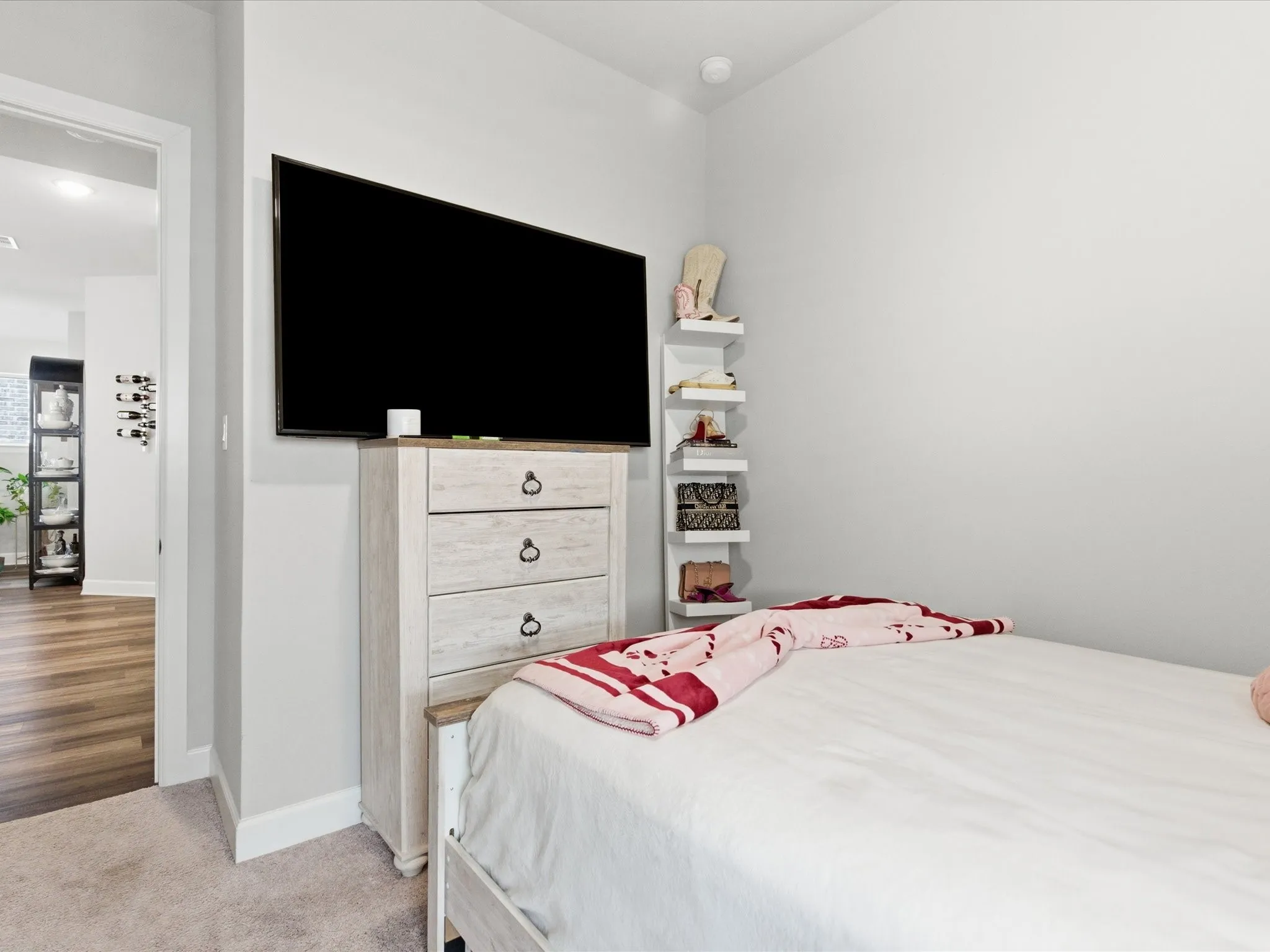 charming bedroom featuring a cozy setup and TV for entertainment, creating a fun and inviting space to relax