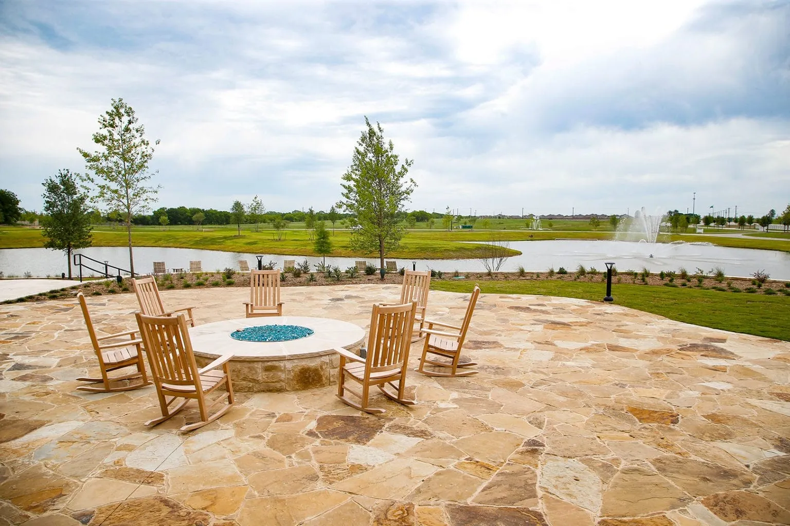 welcoming community patio offering a relaxing outdoor setting, perfect for gathering with neighbors, enjoying the fresh air, and making the most of community living